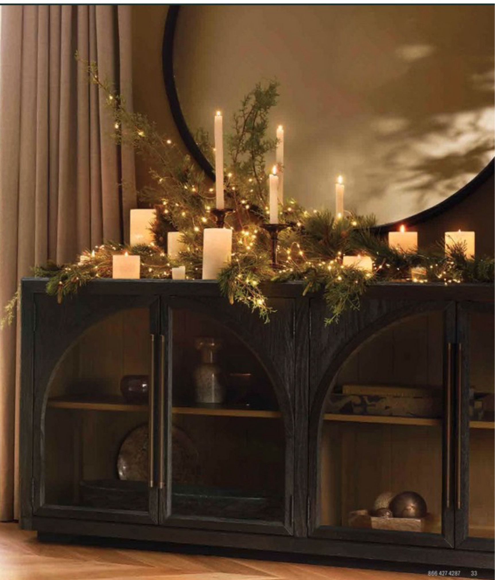 Here are some ideas to make your sideboard festive and welcoming:

1. Seasonal Garland

	•	Add a lush garland with pine, eucalyptus, or faux greenery, and layer it with berries, pinecones, and lights. Drape it along the back edge of your sideboard for an elegant, wintry touch.

2. Candles and Lanterns
	•	Place a mix of candles, pillar holders, and lanterns to add a cozy glow. Try placing candles in varying heights for dimension and a warm ambiance. 
We love the sideboard by Arhaus Is crafted out of oak and oak veneer and is paired  so well with an oversized round casted iron mirror 

#LTKHoliday #LTKHome #LTKCyberWeek