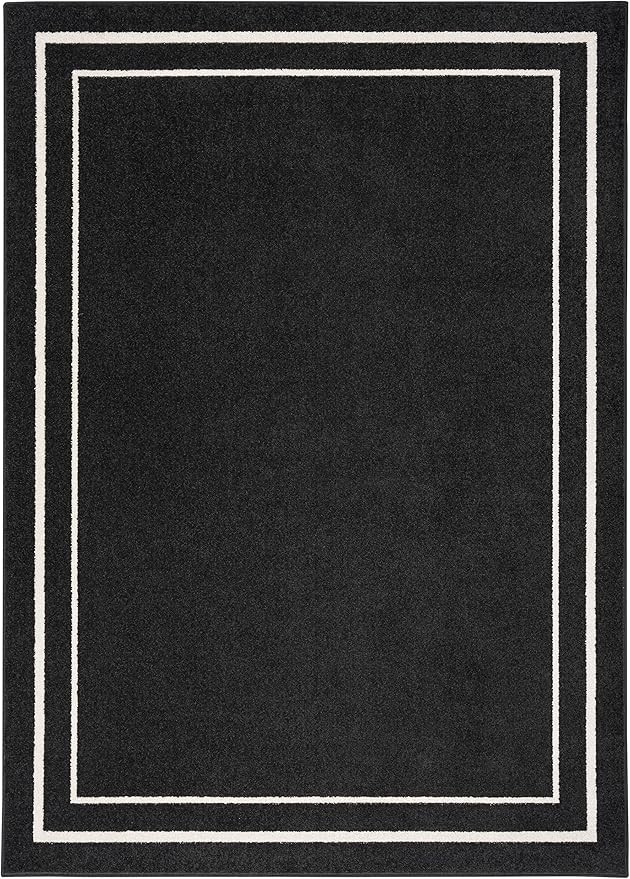 Nourison Essentials Indoor/Outdoor Solid Bordered Black Ivory 5' x 7' Area Rug, Easy Cleaning, No... | Amazon (US)