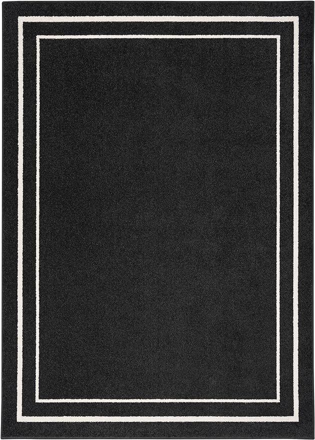 Nourison Essentials Indoor/Outdoor Solid Bordered Black Ivory 5' x 7' Area Rug, Easy Cleaning, No... | Amazon (US)