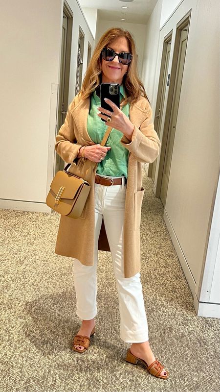 It's a spring outfit of the day.  I love the fresh green linen top with the camel cardigan and white Jeans. 