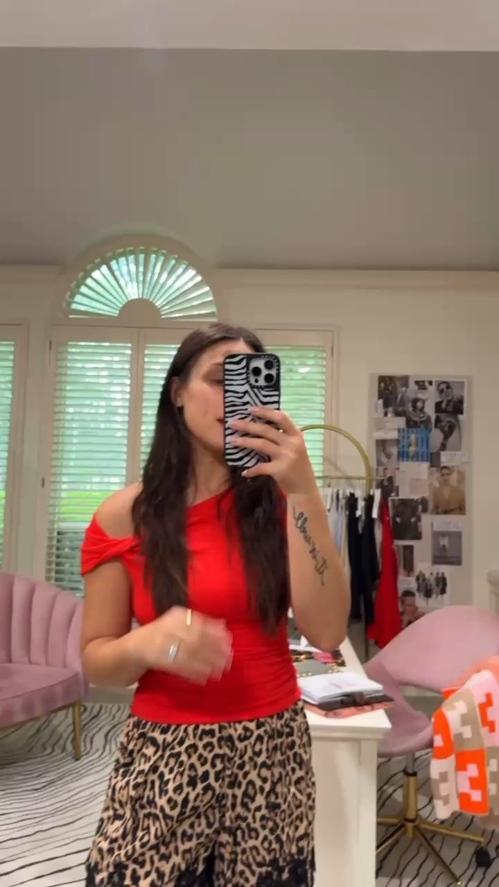 The top that does the work for you.This Old Navy x Christopher John Rogers one-shoulder twist top is the kind of find that makes you do a double-take at the price tag. The ruching hits exactly where you want it — at the waist — and that twisted shoulder detail makes it look far more considered than $39.99 has any right to be.I paired it with leopard shorts and it immediately became a going-out look. Date night, birthday dinner, a rooftop happy hour where you want to look like you tried without looking like you tried.Runs slim — size up if you're between sizes or want a little more room through the bust. The lustrous jersey has real stretch so it moves well, but it photographs even better. 

 #LTKootd #LTKSeasonal #LTKSaleAlert