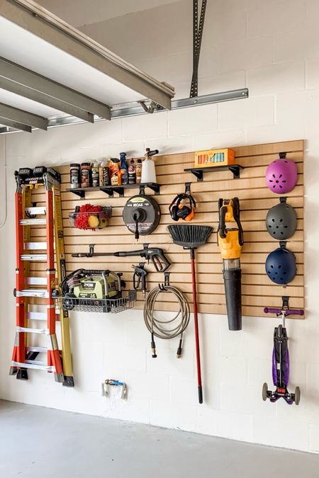 This slat wall organization system is great for keeping your garage organized, especially if you have a smaller one. You can utilize different hooks/baskets for tools and equipments  

#LTKhome