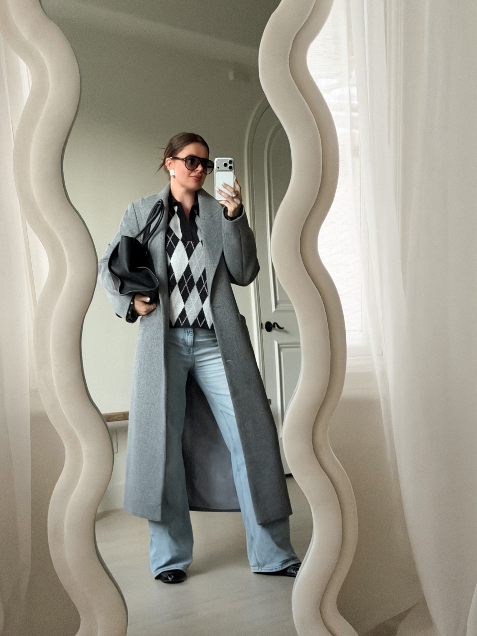 Casual fall outfit inspo. Styling an argyle polo sweater with wide leg jeans, black loafers, grey coat and a classy black tote. 
#argyle #sweater #polo #coat #grey #widelegjeans #tote #zara #therow #aviators 

#LTKSeasonal #LTKFindsUnder100 #LTKootd

#LTKHoliday #LTKgrwm #LTKCyberWeek