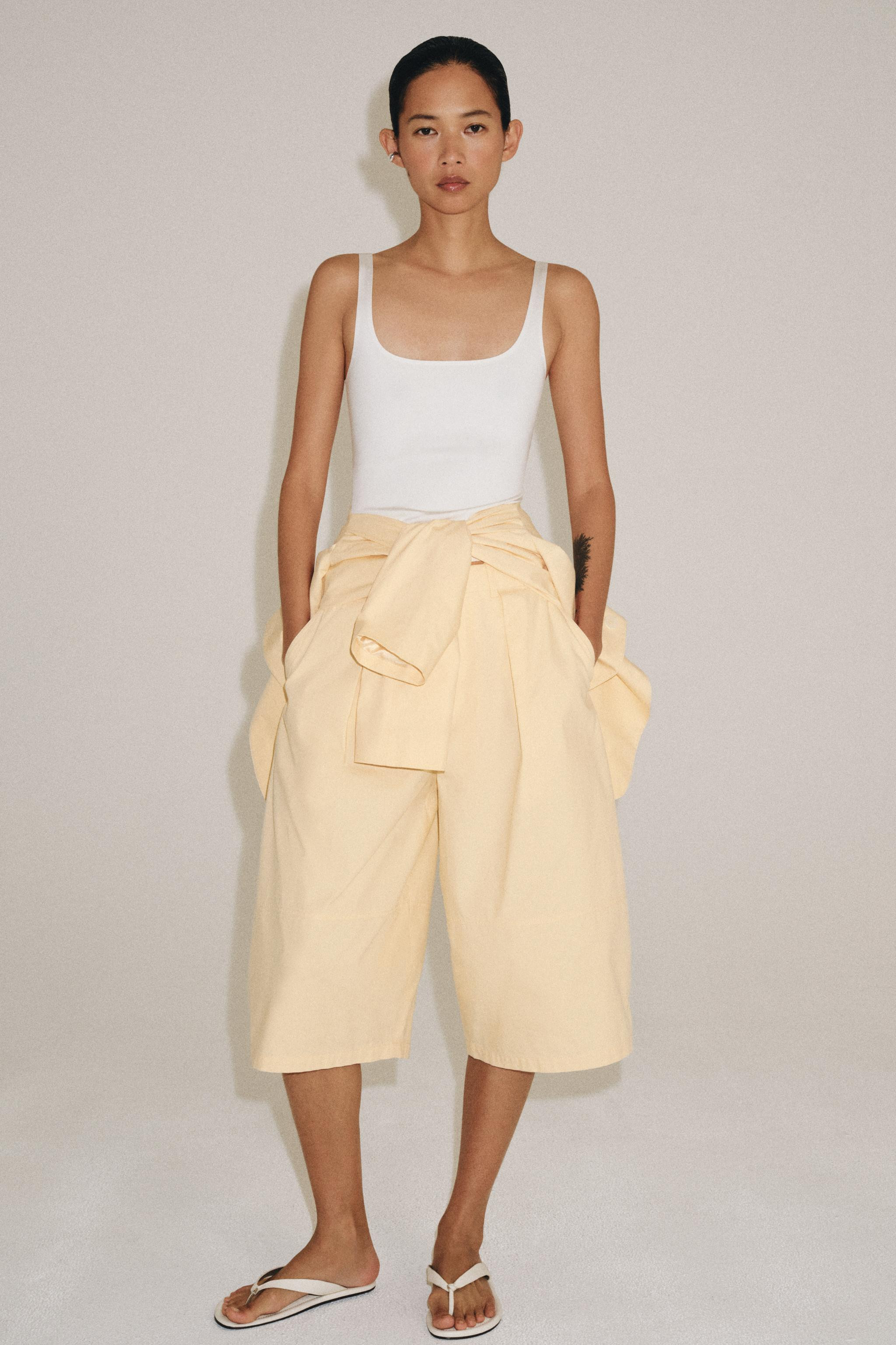 Top crafted from polyamide-blend yarn. Featuring a round neckline, thin straps and a straight hem... | Zara UK