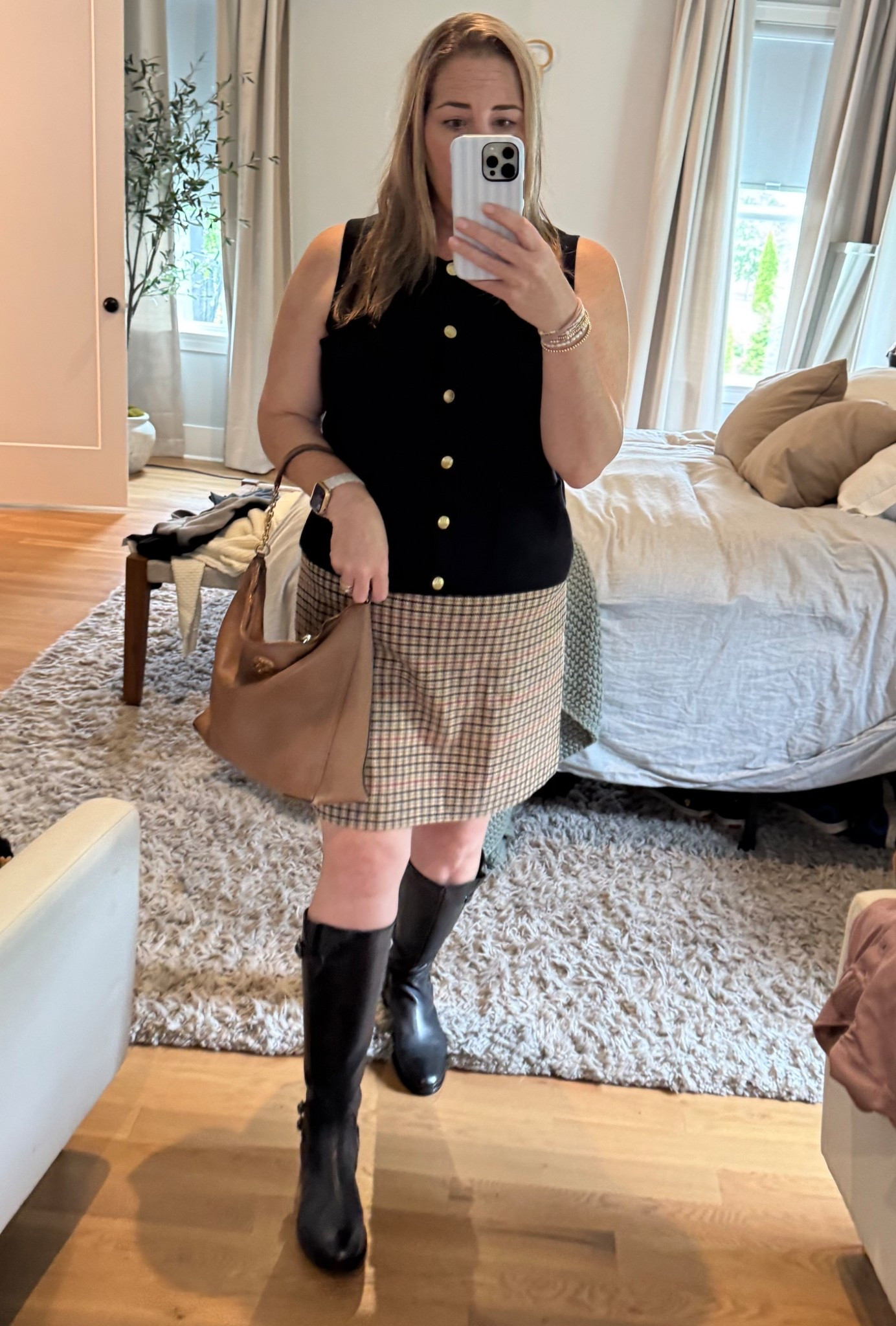 Fall Brunch or GNO Outfit. This plaid wool skirt is the perfect length- not too short but not too long. Pair it with some boots and this cute vest like sweater and you are good to go. 

#LTKPlusSize #LTKOver40 #LTKMidsize