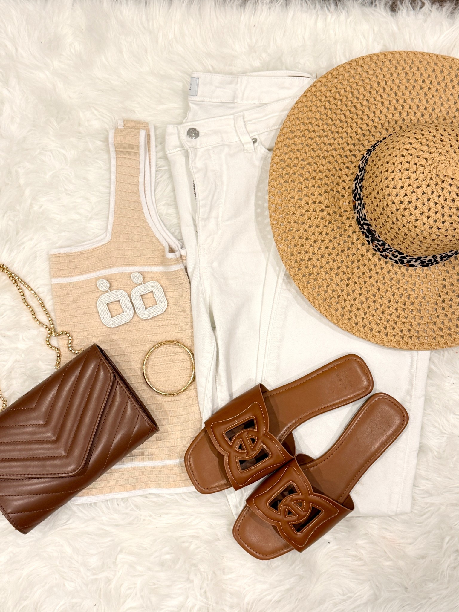 Soft neutrals are my go-to for an easy, polished spring look 🤍✨ This little knit tank paired with white denim is such a chic combo, and the brown accessories pull everything together perfectly. Effortless, classic, and so easy to mix + match!

Wearing size L in the top and size 14 in the jeans for reference 🤎

You can dress this up with wedges or keep it casual with slides—either way, it’s one of those outfits you’ll reach for on repeat!

#LTKOver40 #LTKMidsize #LTKootd