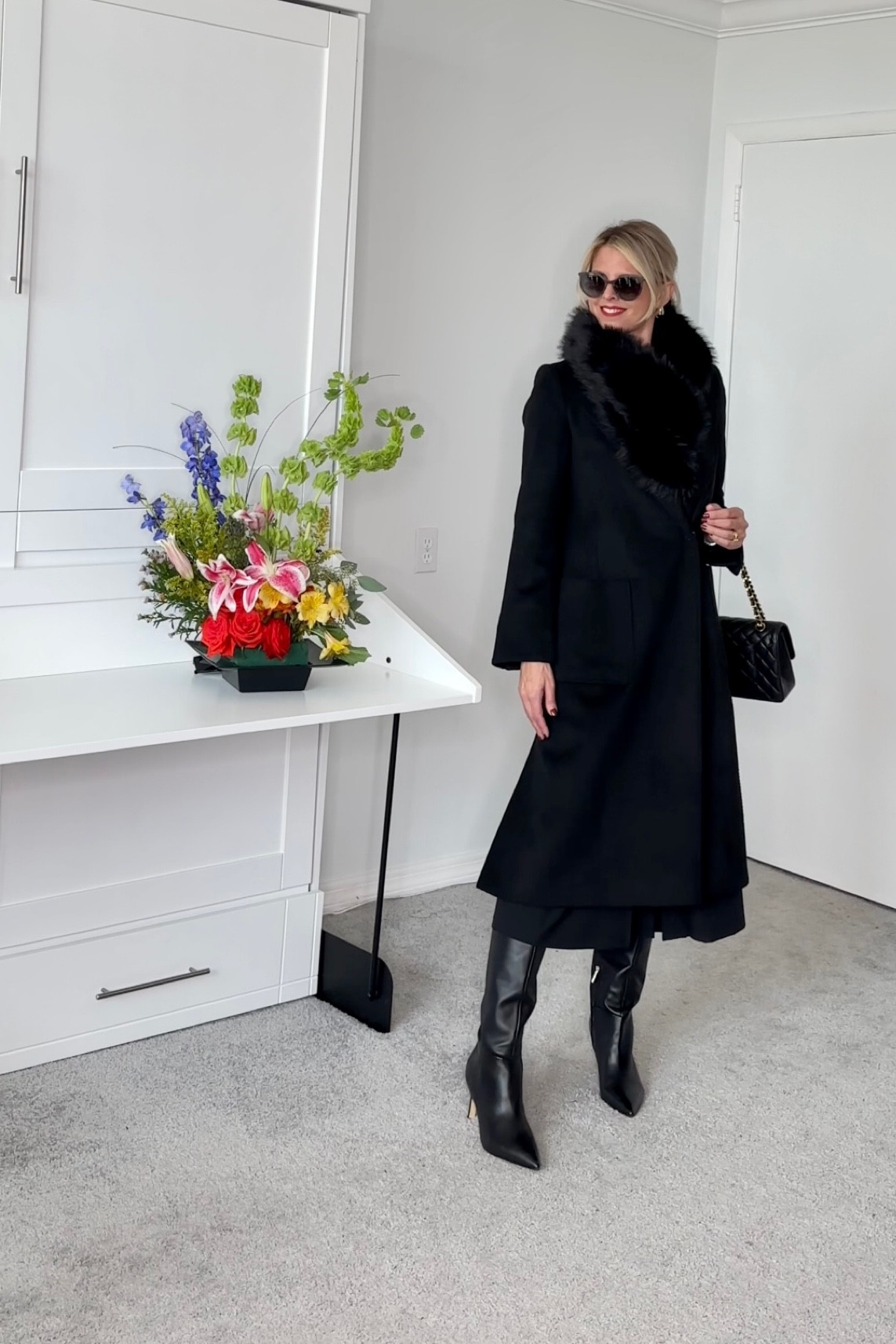 The boots run large.   I'm typically a 7-7.5,  in this pair of boots the 7 is the correct size.      They come in both narrow and regular calve sizes.  Im wearing the narrow.   

The coat I'm wearing my usual size and it's slightly snug.  The reviews also mention it runs small.   I recommend sizing up a size especially if you plan to wear sweaters under it.

#LTKHoliday #LTKSeasonal #LTKCyberWeek