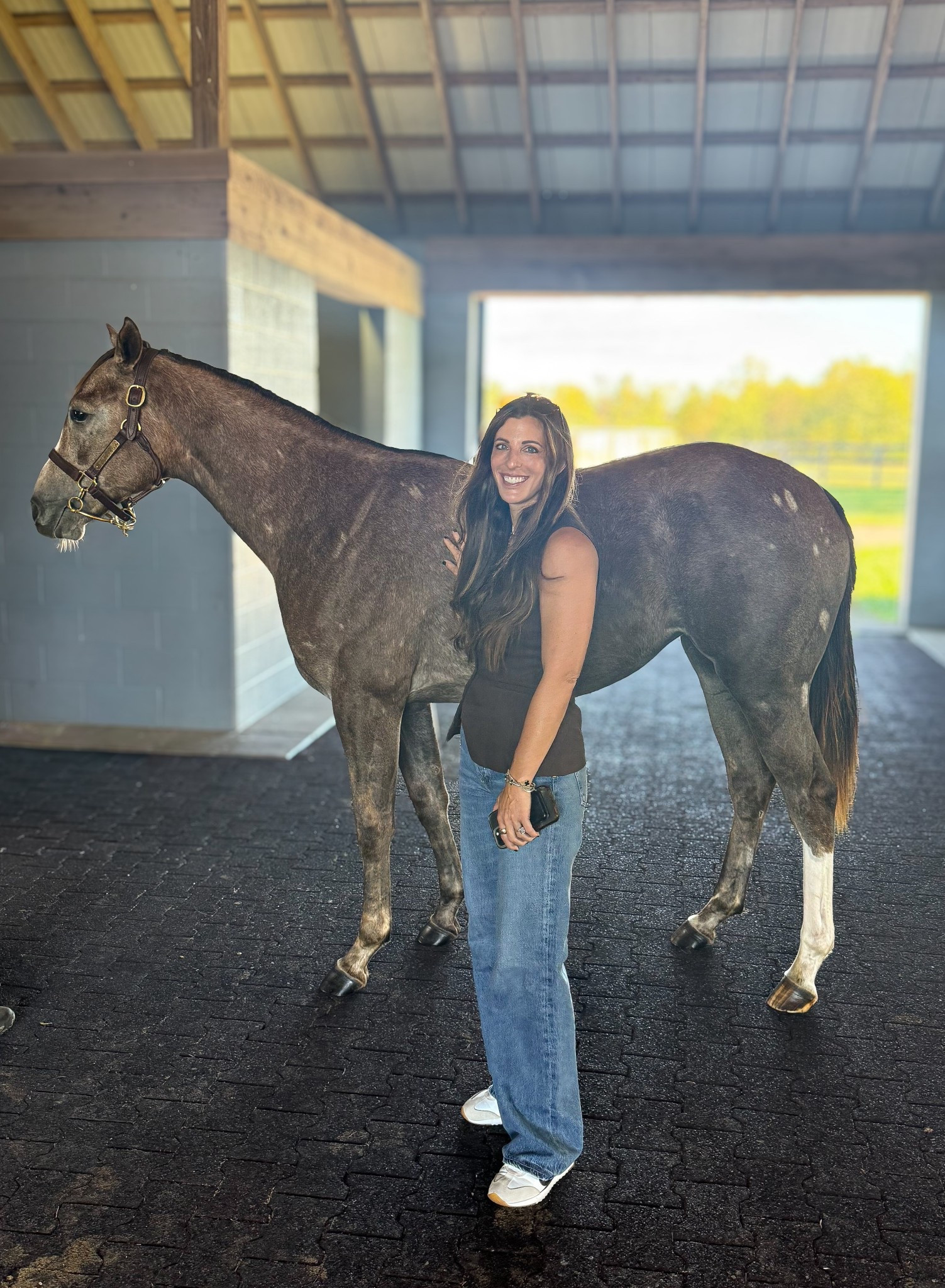 Feeling beyond thankful for the incredible team we’ve met and partnered with in this horse racing world — people who genuinely love these horses and take such amazing care of them. Owning horses has been my dream since I was a little girl, and it still feels surreal that it’s finally come true. Watching our two-year-olds grow before they ever hit the track is such a special experience.  There’s a heated debate over what to name this handsome grey colt, so drop your suggestions below! Filly name reveal coming soon! 

#HorseRacing #ThoroughbredLife #EquestrianLifestyle #RacehorseOwner #HorseRacingDreams #FarmLife #CountryLifestyle #EquestrianGoals #HorseLovers #StableLife #DreamComeTrue #RaisingRacehorses #FutureChampion #EquestrianCommunity #LikeToKnowItLifestyle #LTKEquestrian #LTKCountryLife #LTKFarmStyle

⸻

Outfits:
Casual and comfortable barn day look!   I’m wearing a chocolate brown sleeveless top, high-rise flared jeans, and white sneakers — easy, effortless style that’s both flattering and practical for walking the barn aisles.

#EquestrianStyle #CountryOutfit #BarnStyle #CasualChic #LTKStyle #LTKUnder100 #FarmFashion #RanchWear #HisAndHersStyle #WeekendStyle

#LTKWorkwear #LTKOver40 #LTKTravel