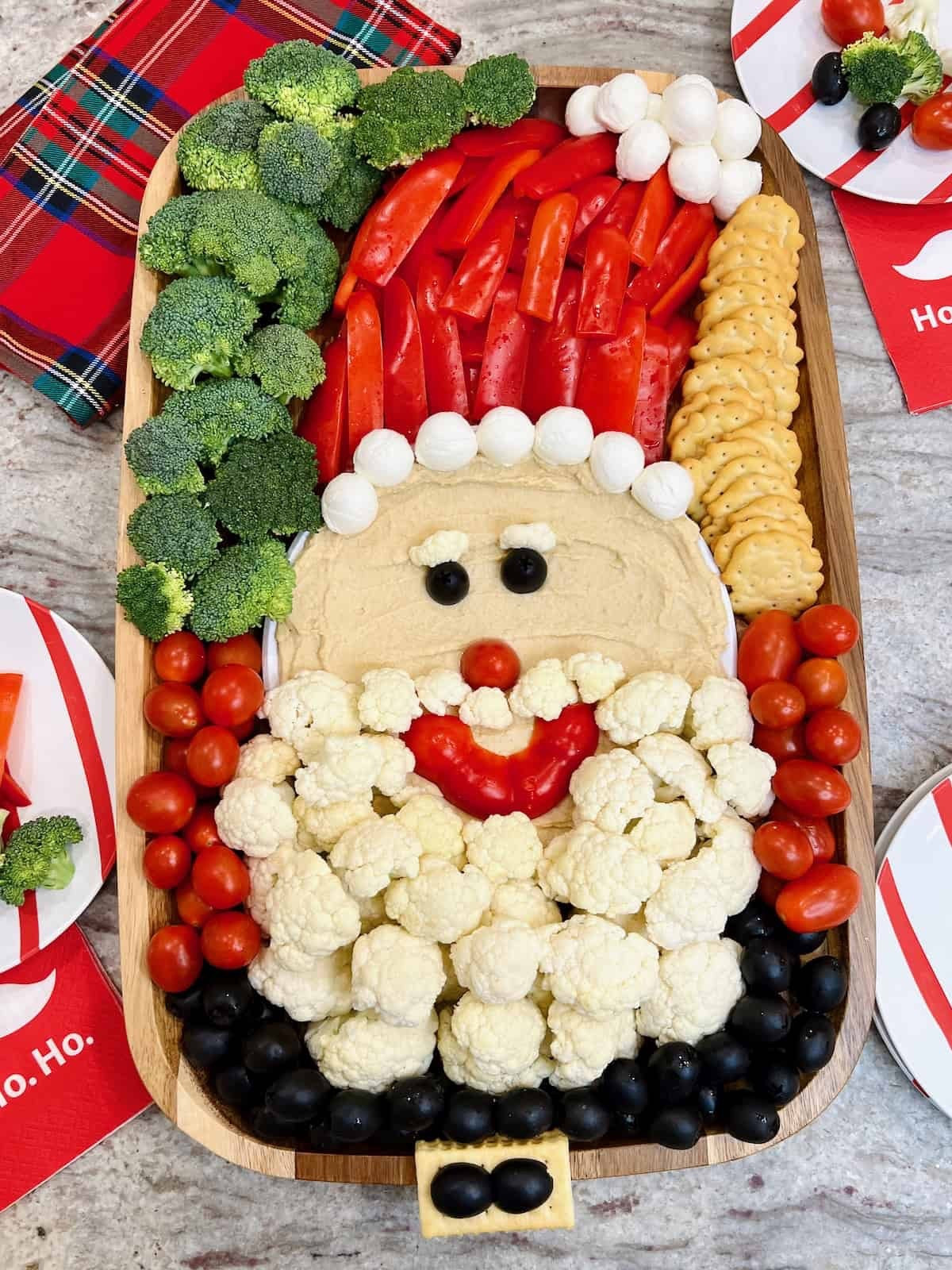 This simple and oh-so-cute Santa Snack Board, made out of hummus, veggies, cheese and crackers, is sure to put you at the top of the nice list!

#LTKfoodie #LTKSeasonal #LTKHoliday