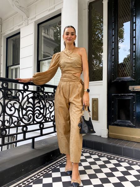Matching camel co-ord, asymmetric top with cut-out, wide leg trousers, two-tone ballet flags, black bag