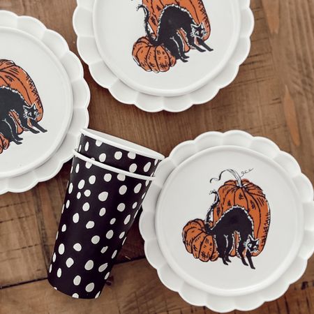 Cute stoneware cat and pumpkin plates I found and layered with some scallop plates.  

#LTKhome #LTKSeasonal #LTKHalloween