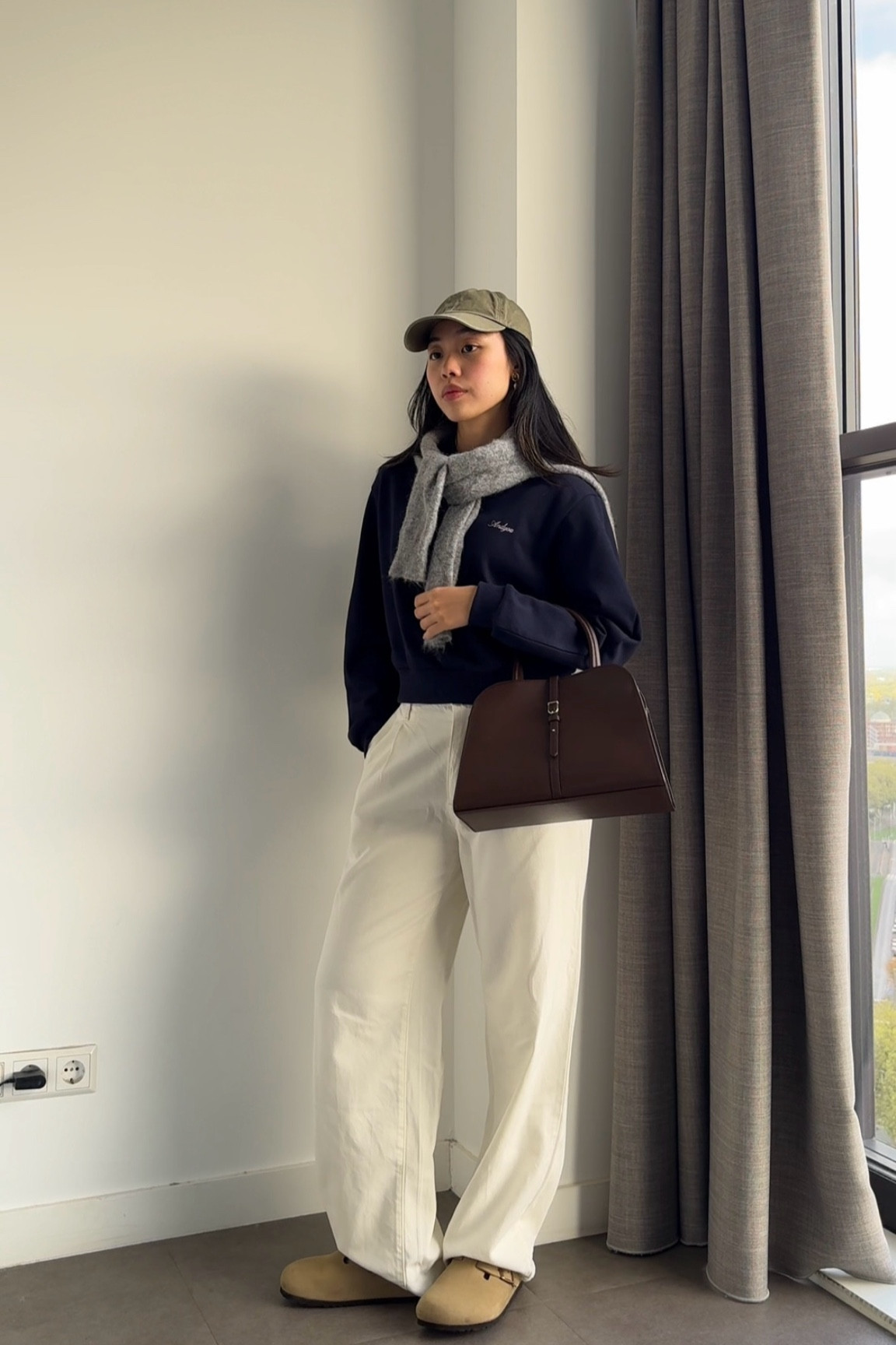 Casual and chic fall outfit: navy polo from a Korean brand called And You, denim pants are from Uniqlo, cap from Colorful Standard, and bag is from Monorow (the Row Margaux dupe!!!)

#LTKStyleTip #LTKSaleAlert #LTKFindsUnder100