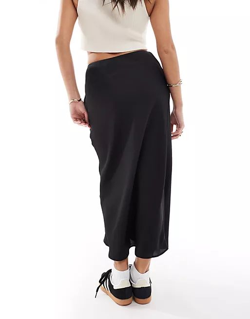 ASOS DESIGN Petite satin bias midi skirt in black | ASOS (Global)