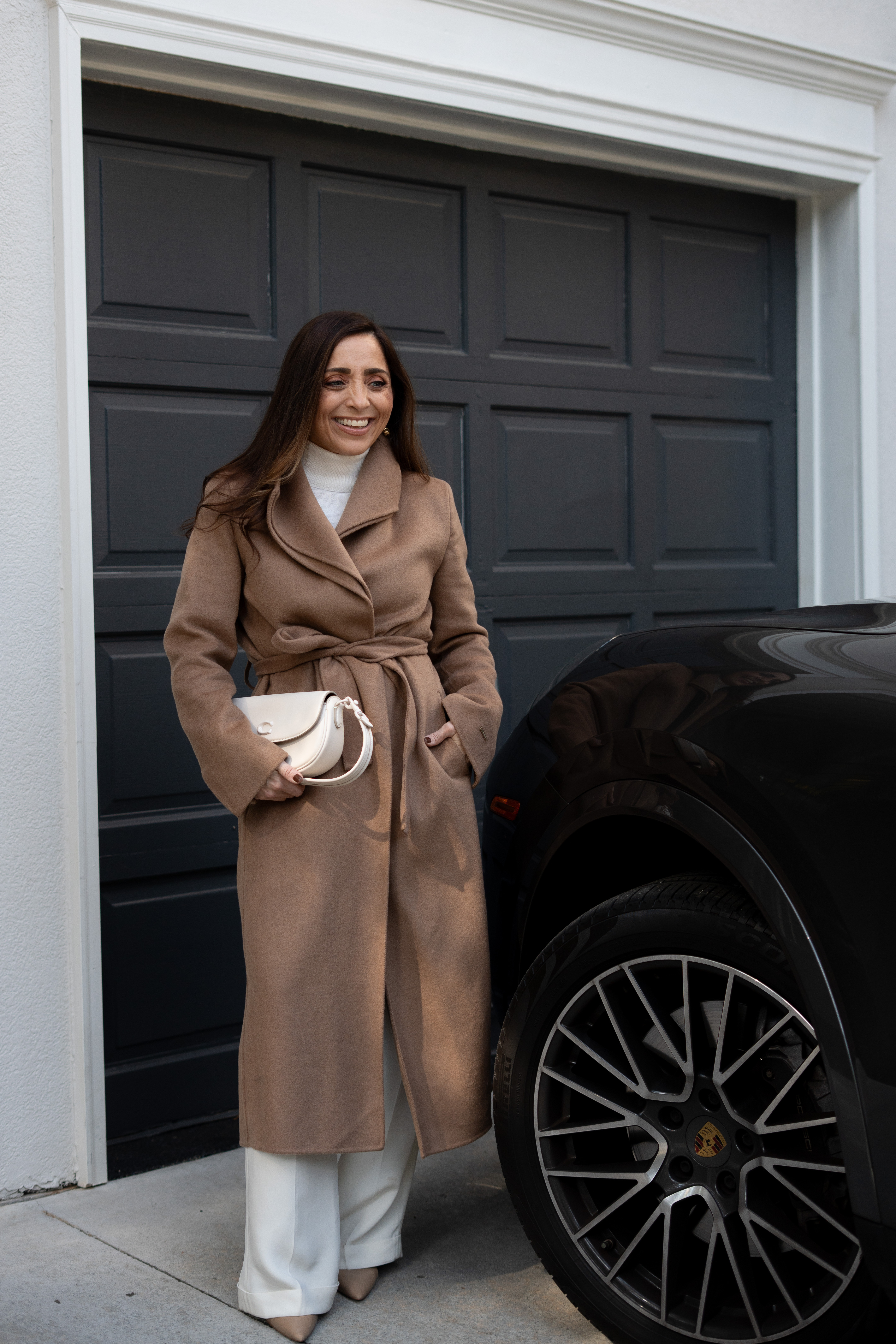 OMG this look has me feeling all the luxe fall vibes. The rich camel coat, creamy whites, and tailored details come together so effortlessly — it’s that perfect balance of cozy and polished. The clean, modern background makes the outfit stand out even more, and I love how the light hits just right to bring out every texture and tone. Eeepp it’s giving quiet luxury in the best way — timeless, confident, and oh so chic! 

 #LTKSeasonal #LTKStyleTip #LTKItBag