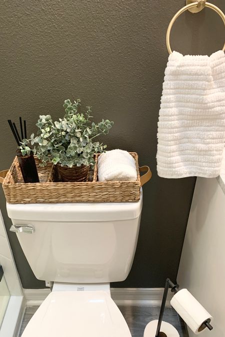 Affordable Bathroom decor items in my guest bath.  Bathroom storage, tank basket, reed diffuser, towel holder, Amazon, Target 

#LTKfamily #LTKunder50 #LTKhome