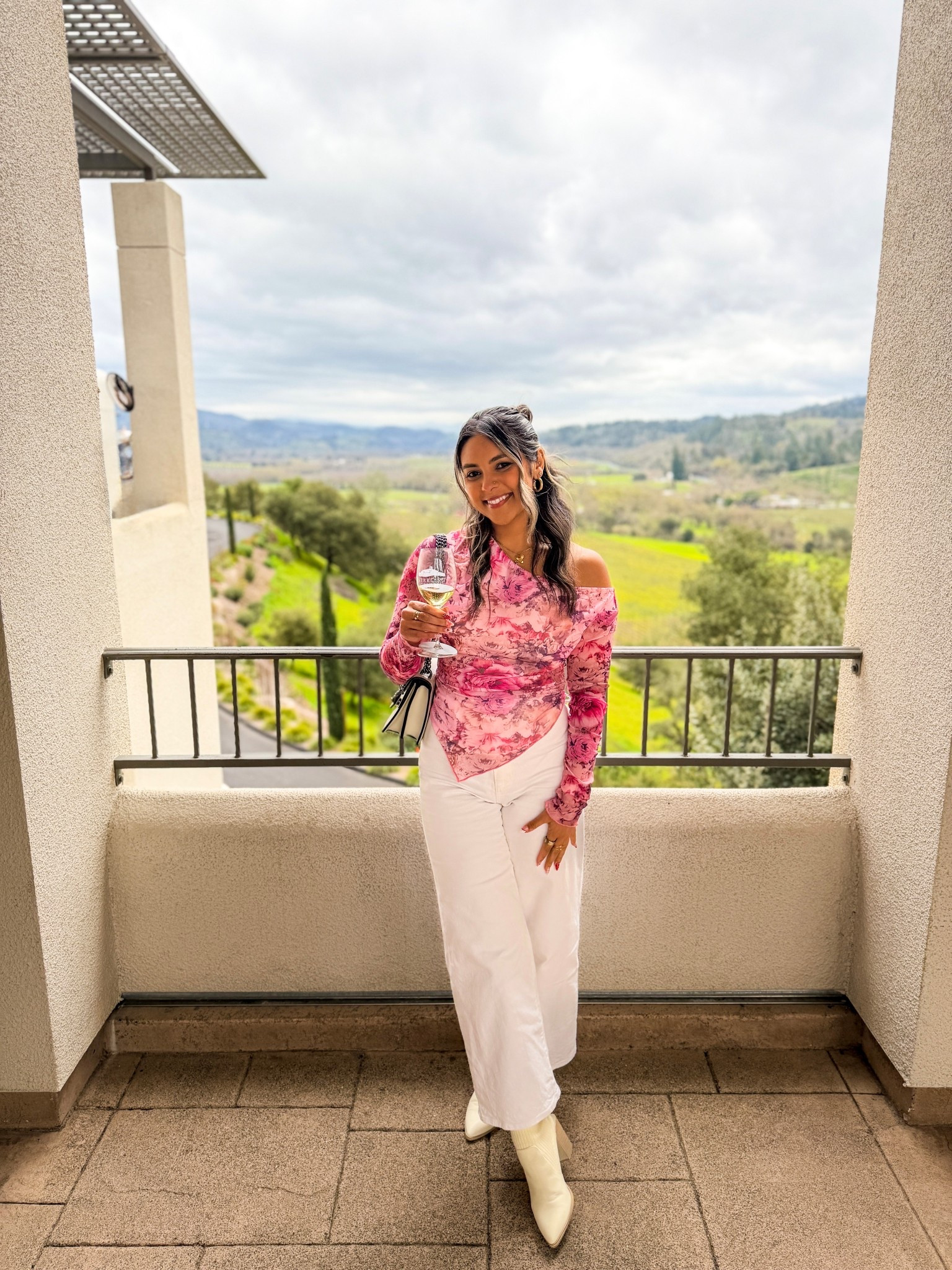 Wine country views + a pink moment 🍷🌸

Wearing a romantic one-shoulder floral top paired with chic white wide-leg pants and cream boots — the perfect elevated look for winery days, brunch dates, or spring events. 

#LTKStyle #WineryOutfit #SpringStyle #ChicAndEffort

#LTKdayinmylife #LTKSeasonal #LTKootd