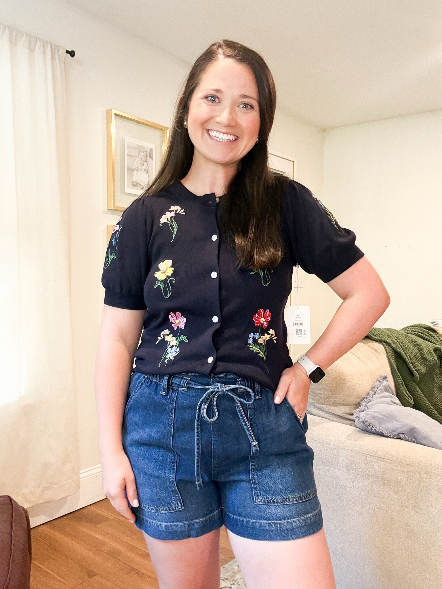 Summer outfit. Embroidered sweater. Denim shorts