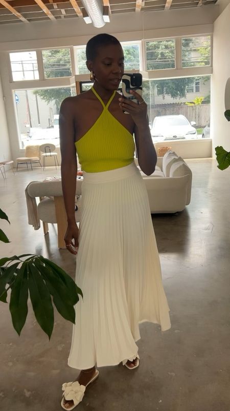 Affordable spring outfit! White pleated maxi skirt, lime halter top, gold drop earrings and white floral sandals. I’m wearing a small in both  

#LTKfindsunder100 #LTKfindsunder50