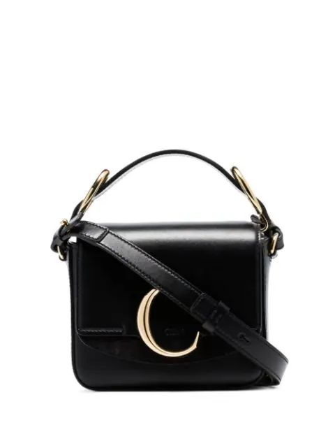 black C ring top-handle leather shoulder bag | Farfetch (UK)