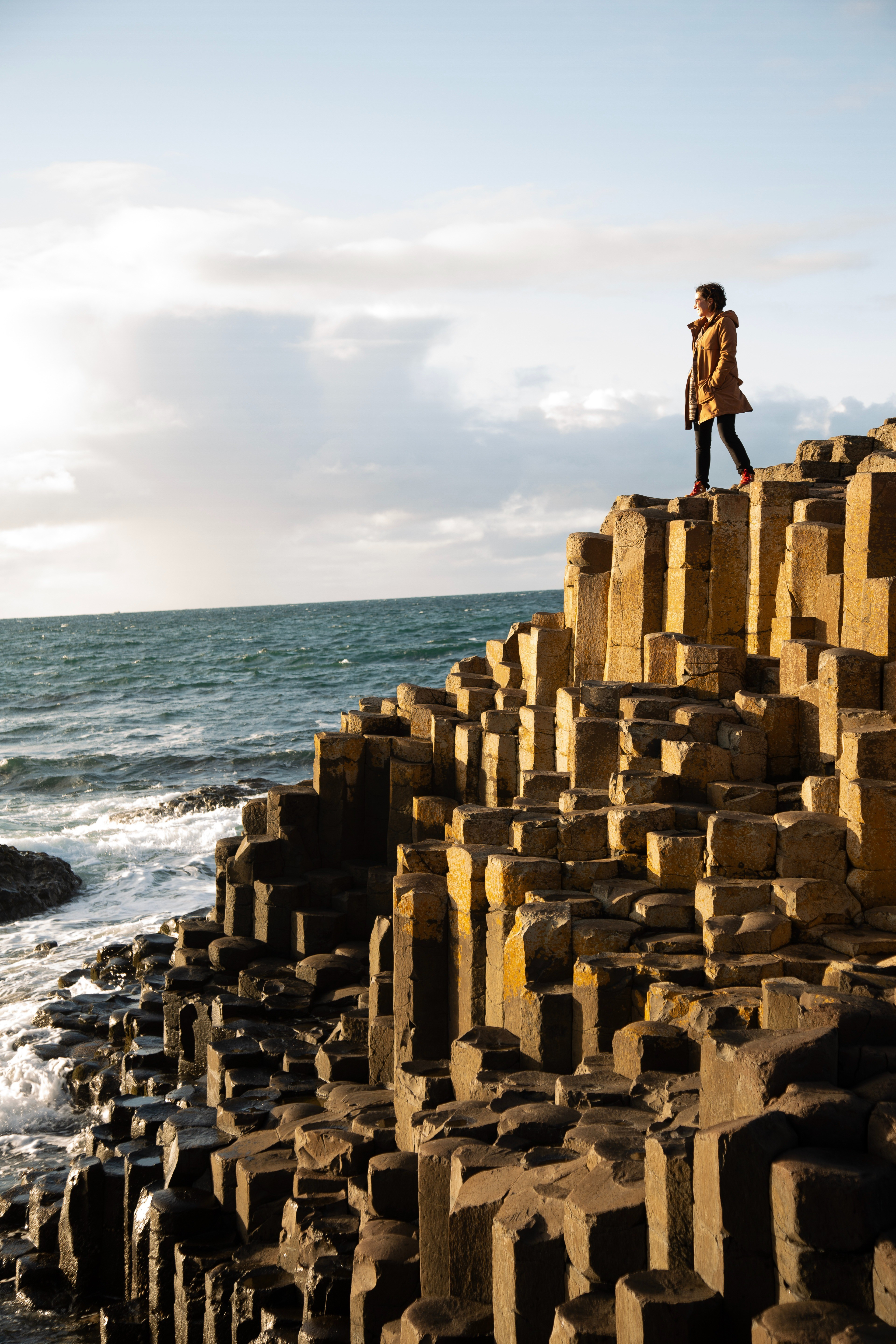 Who knows where this is? Hint: it’s still Earth…just the part that looks like it was designed by aliens.The Giant’s Causeway in Northern Ireland is made up of roughly 40,000 interlocking basalt columns formed by volcanic activity about 60 million years ago. Most of the stones have that distinctive hexagon shape, and the whole formation stretches along the coast at the base of the cliffs. It’s one of Northern Ireland’s most famous UNESCO World Heritage Sites, and you can climb the stones (just be careful and wear grippy shoes!), walk the coastal trails above, and explore the viewpoints around the site.It was one of my favorite stops of my entire road trip around Ireland. Don't sleep on Northern Ireland! #irelandroadtrip#Ireland #irelandtravel #northernireland #giantscauseway 

#LTKdayinmylife #LTKTravel #LTKSeasonal