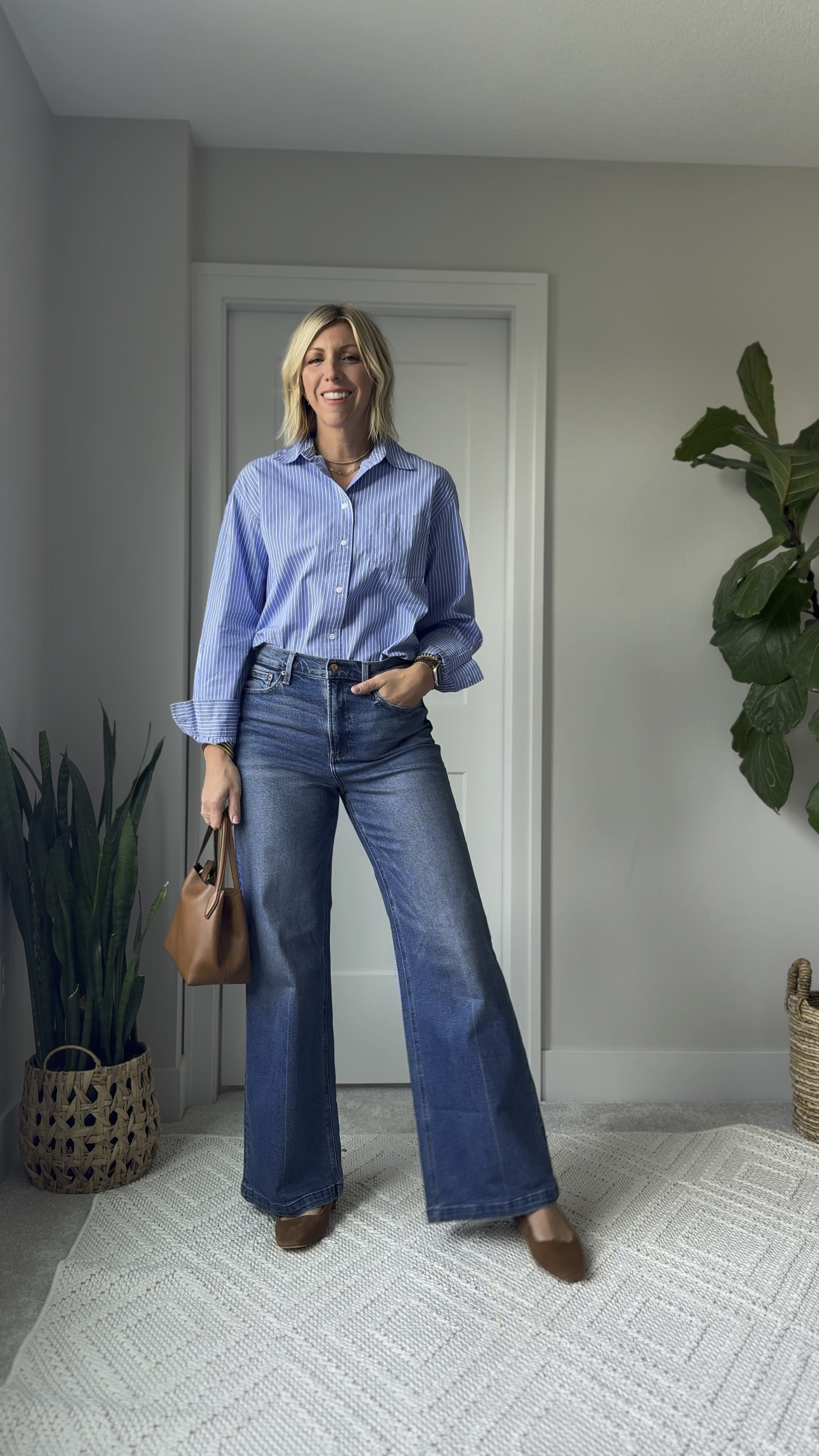 A stripe shirt is such a classic wardrobe staple! I love how easily it elevates a pair of jeans + sling back flats! This oversized fit looks great tucked or untucked depending on what style you prefer. I’m wearing my true size small tall 

#LTKBacktoSchool #LTKFindsUnder100 #LTKOver40