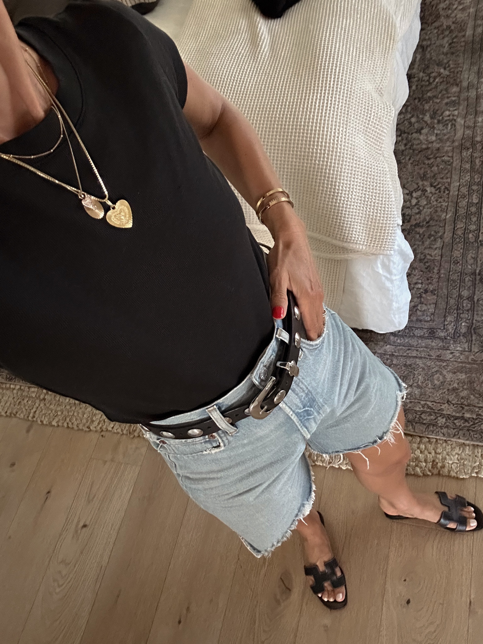 Today’s OUTIFT 
One of my favorite black ribbed tees 
Studded belt will be great with jeans in the fall 
Go-to cut offs are 20% off during the Shopbop sale 

#LTKOver40