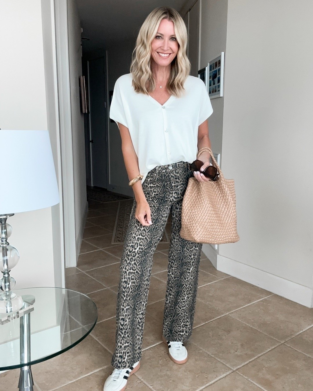 These leopard pants are such a fun break from basic denim, but still surprisingly easy to style. I kept everything else simple with a drapey white button front top and sneakers, and I love how the wider leg keeps the print feeling relaxed instead of overdone.

leopard pants, animal print pants, wide leg pants, casual outfit idea, statement pants, white blouse, sneaker outfit, transitional outfit, women’s fashion, printed pants, everyday style, hauteandhumid

#LTKootd #LTKSeasonal #LTKOver40