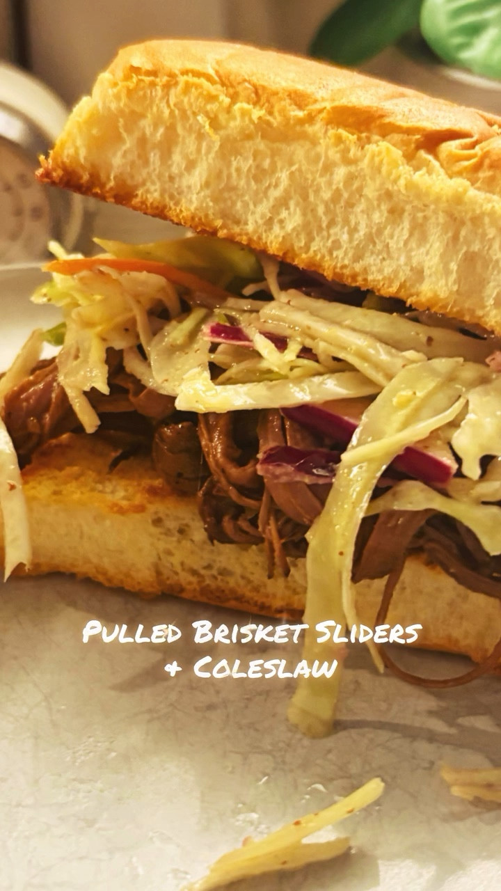 What if the best kind of party is the one that starts in the kitchen? No confetti, no guest list, just brisket slow-cooked until it falls apart, piled onto soft rolls, and finished with a cool crunch of slaw.

Inspired by Julie & Julia, I’m cooking my way through Magnolia Table Volumes 1, 2, and 3. I’m calling it The Jeanie Jo & Joanna Project. Recipes 63 and 64 of 457 are Pulled Brisket Sliders & Coleslaw—and here’s how they turned out.

The brisket was tender and smoky, sweetened by its sauce and hugged by the bread like it was meant to be there. The slaw brought balance, crisp and bright against the richness. Together they felt like summer barbecue, even if eaten indoors on a Thursday.

393 recipes to go!
Gracefully yours,
🫶🏻 Jeanie Jo

#thejeaniejoandjoannaproject #MealAndGrace @joannagaines @magnolia #magnoliatablecookbook #magnoliatable #magnoliacookbook #joannagaines #cookbookchallenge #magnoliatablevolume2 @magnoliatable @visitmagnolia #visitmagnolia #sincerelyfood #sincerelyrandalls #magnoliatablevolume3
#magnoliatablerecipes

#LTKHome