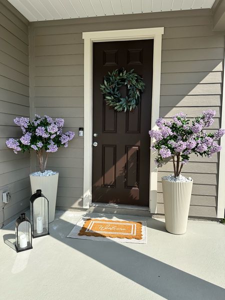 So in love with these new planters! My faux lilac trees are from QVC but still sold out. I found almost exact ones at Home Depot linked below! Summer front porch, outdoor planters, tall planters, patio decor 

#LTKSeasonal #LTKHome