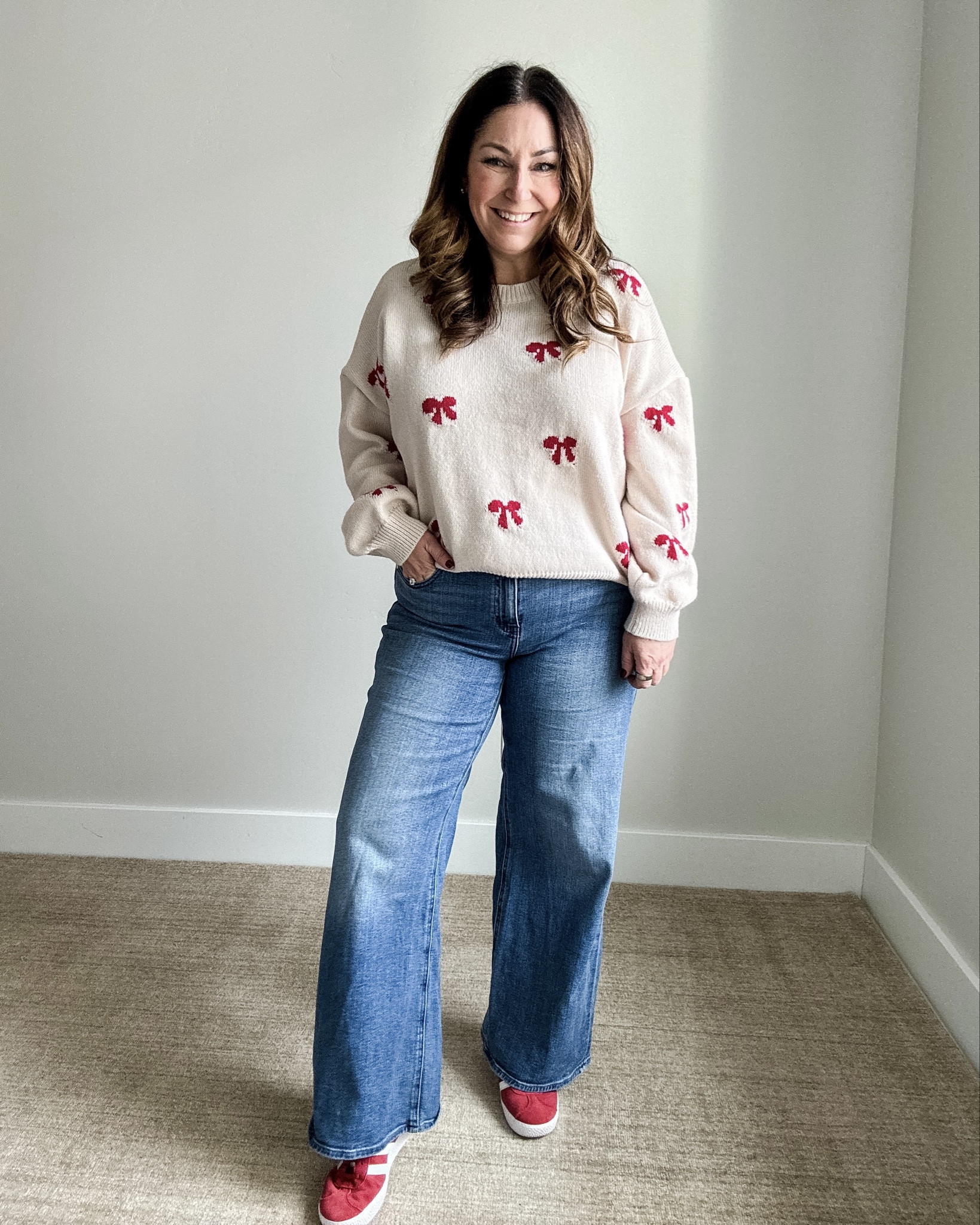 Holiday Red Bow Sweater Outfit #holidayoutfit #christmasbows #bowsweater #boldsneakers 

 

#LTKHoliday #LTKOver40 #LTKMidsize