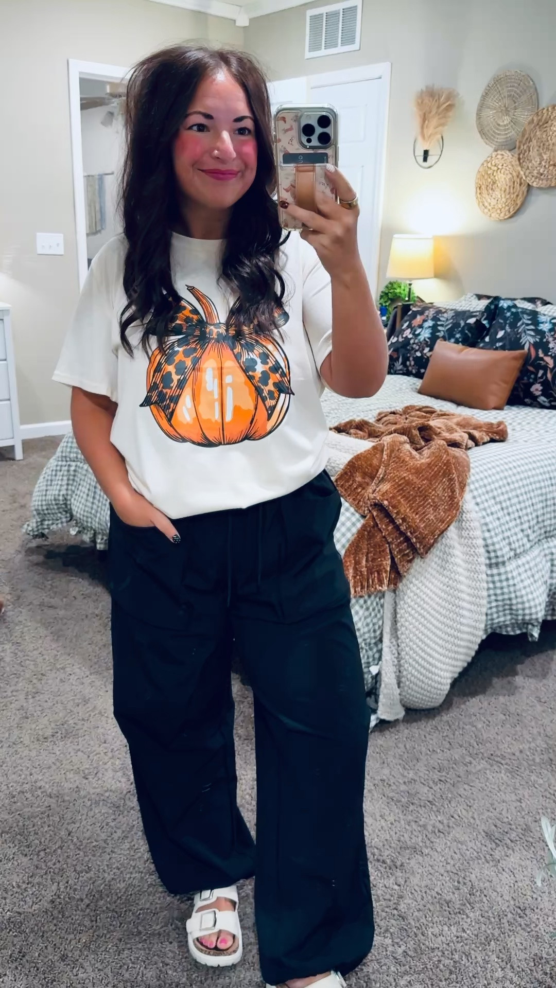 Pumpkins & bows for the classroom! 🎃🖤 This Amazon tee has the cutest leopard bow detail, and I paired it with relaxed black pants & little bow earrings. A little pumpkin style to wear all the way through Thanksgiving!

sandals: sold out, but linking similar options below!
pants: oversized // wearing a medium
tee: fits true to size // wearing a large 

 #LTKootd #LTKMidsize #LTKWorkwear