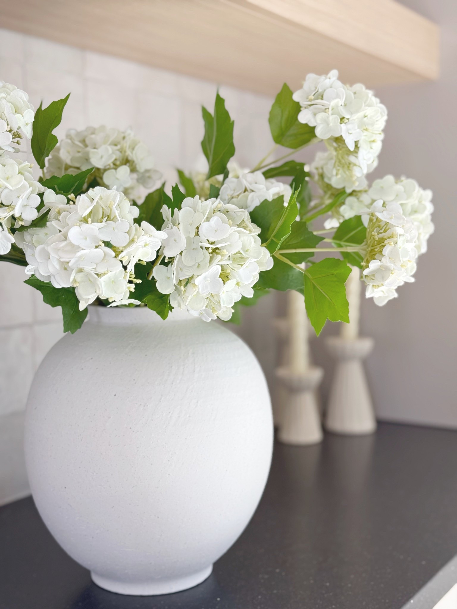 This white vase and faux hydrangeas are both Amazon finds, and they’ve quickly become some of my favorite home decor pieces. They add the perfect soft, fresh touch for spring and make styling any space feel effortless. So many great Amazon home decor options to pull together a look like this!

#LTKFindsUnder100 #LTKHome #LTKFindsUnder50