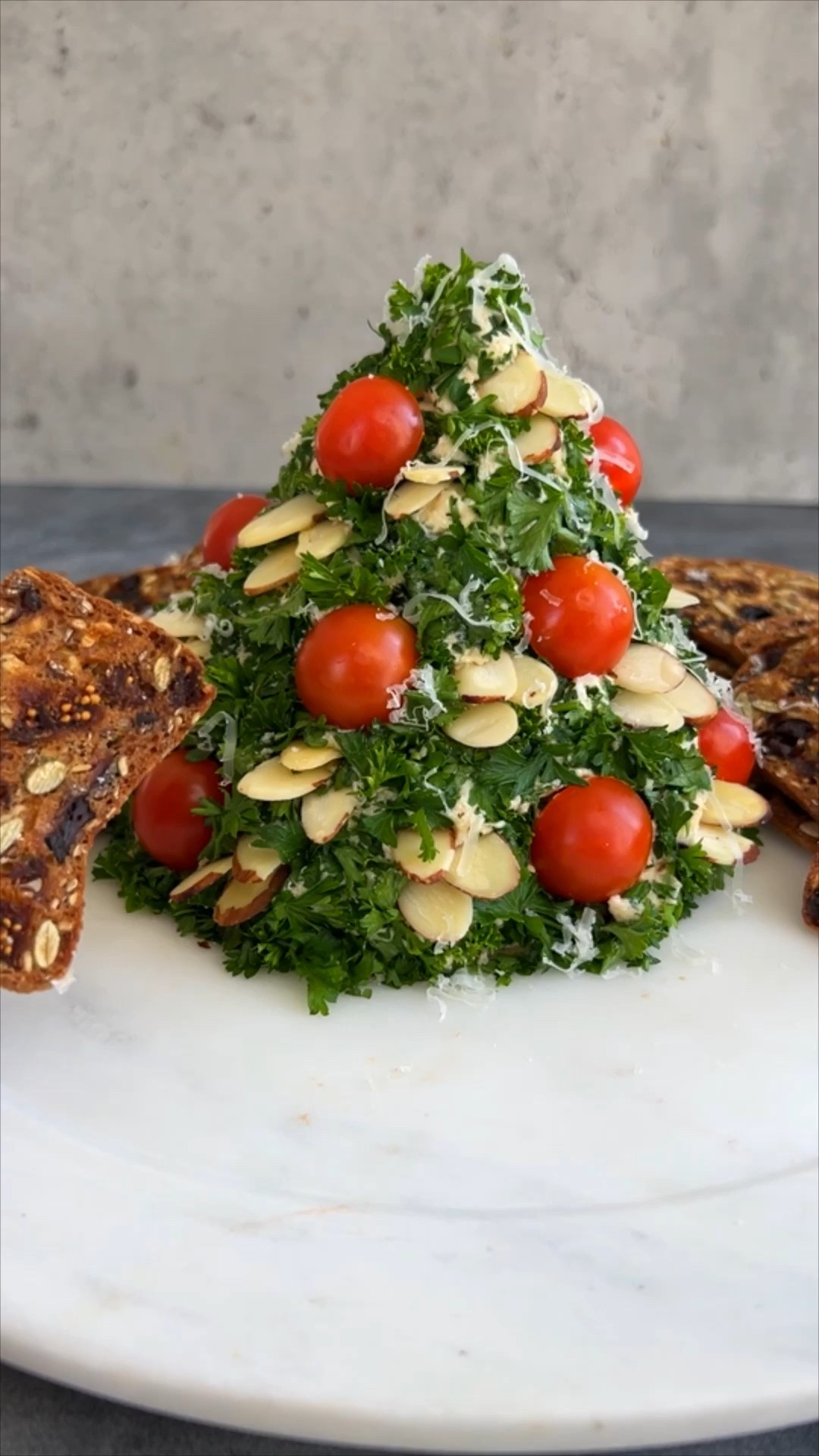 Christmas App Idea 

Ingredients
* 16 oz cream cheese softened
* 6 oz Grand Cru grated
* 1 1-oz packet dry onion soup mix
* 1/3 cup sliced almonds
* 6 cherry tomatoes halved
* 1/2 cup parsley chopped
* Crackers for serving

Instructions 
* In a medium bowl, mix cream cheese and soup mix until fully combined. Add Grand Cru cheese and stir to combine. 
* Using your hands and/or a rubber spatula shape the mixture into a cone, pointy end up. Top with parsley and use plastic wrap to gently press onto the cheese. Refrigerate for at least 2 hours. 
* When ready to serve, let tree stand at room temperature for 15 minutes. Press tomatoes and almonds into the cheese to decorate. before serving. 
* Serve with your favorite crackers and enjoy! 
https://ainttooproudtomeg.com/holiday-christmas-tree-cheese-ball/

#LTKHoliday #LTKHome #LTKSeasonal