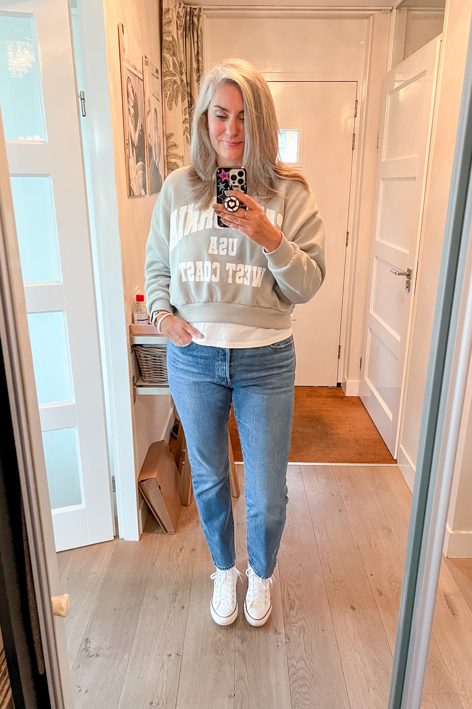 Working from home in this gorgeous sage green cropped (but not too cropped) sweater with California print, layered over a basic white t-shirt to add some interest and I am back wearing Levi’s 501 jeans again. Last time I wore them was in high school but I love the fit (wearing 32/32” on a 36” inseam). White Chuck Taylor converse All Stars complete the look. 



#LTKover40 #LTKmidsize #LTKstyletip