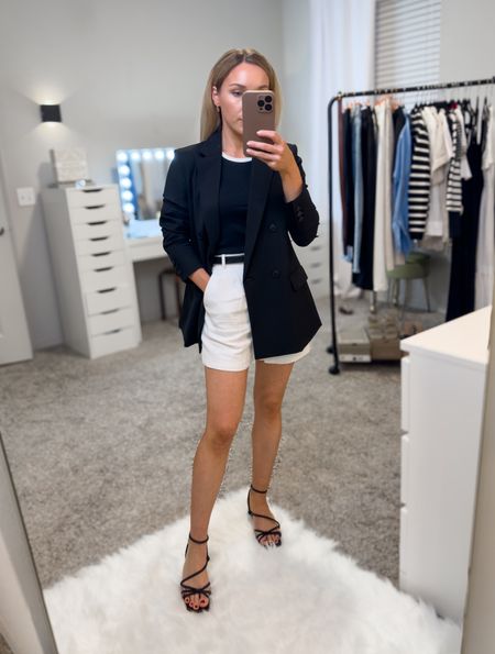This black blazer and contrast trim tank are both currently on sale. Wearing size xs for an oversized fit in the blazer. Abercrombie tailored linen shorts are available in 3 color ways, wearing size 24. Black strappy sandals have a kitten heel and fit tts, wearing 6.5. 

#LTKworkwear #LTKfindsunder100 #LTKsalealert