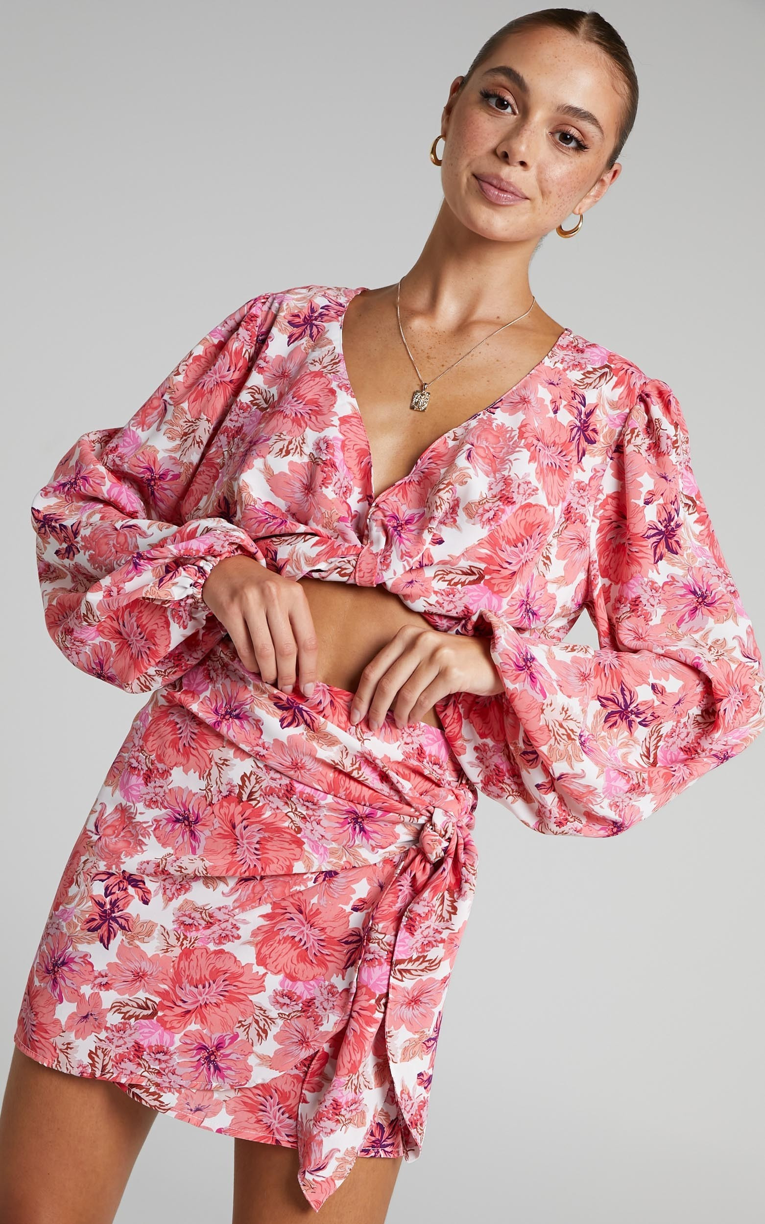 Geneve Wrap Side Tie Printed Mini Skirt in Pink Floral | Showpo (ANZ)
