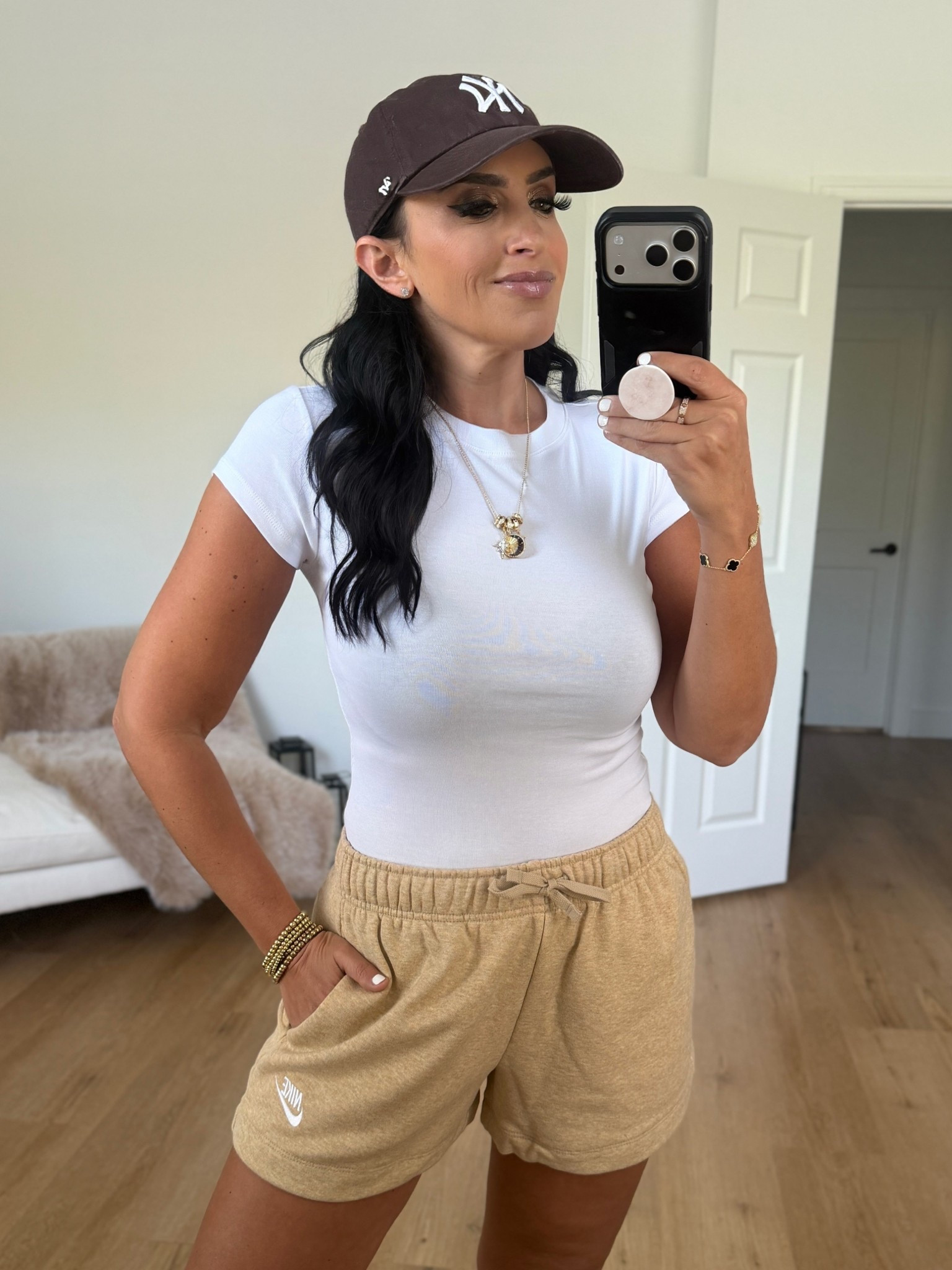 Nike sportswear club fleece women’s mid rise shorts linen heather white wearing size medium 