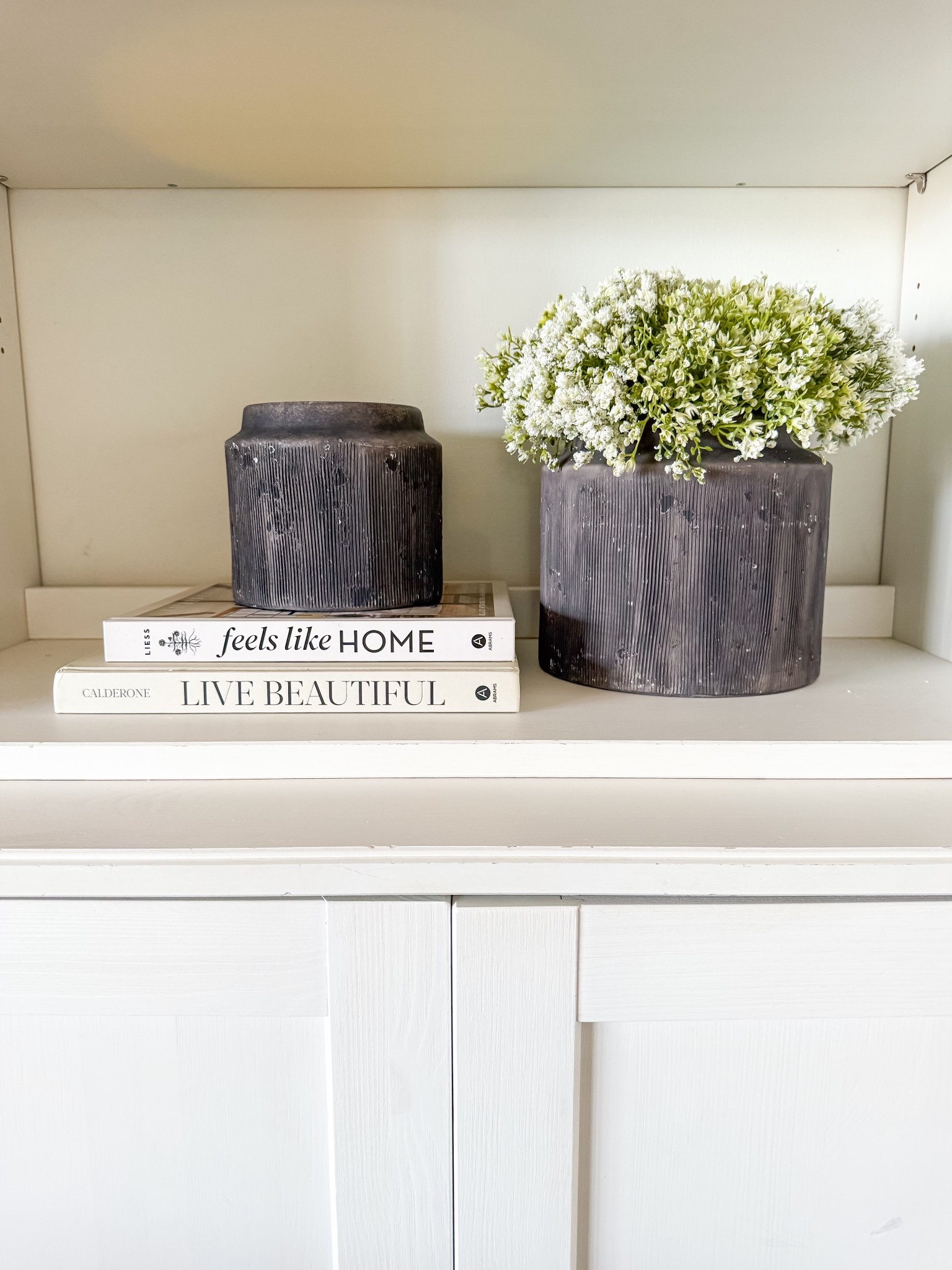 Texture and distressed black planters styled 

#LTKHome #LTKFindsUnder50 #LTKStyleTip