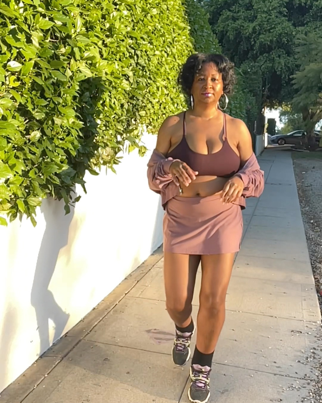 It’s something about the sun hitting this color 💜…. March mauve set from @Fabletics  skort, sports bra and light jacket… real effortless. 🤏🏾 
#fabletics #fableticspartner #athleisurestyle #momlife

#LTKActive #LTKmomlife #LTKOver40