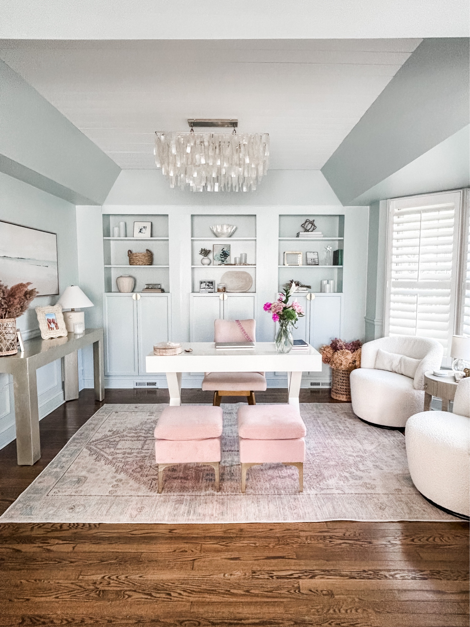 This room used to be our dining room and by using 3 IKEA Billy bookcases it has become the perfect home office space.

Home office decor, desk decor, transitional area rug, blush area rug, office accent rug, swivel chairs, capiz chandelier, coastal chandelier, bouclé swivel chair, ceramic table lamp, blush dining chair, white desk, X-cross leg desk, round side table, raffia end table. 
#homeoffice #officedecor #desk



#LTKFind #LTKhome #LTKstyletip