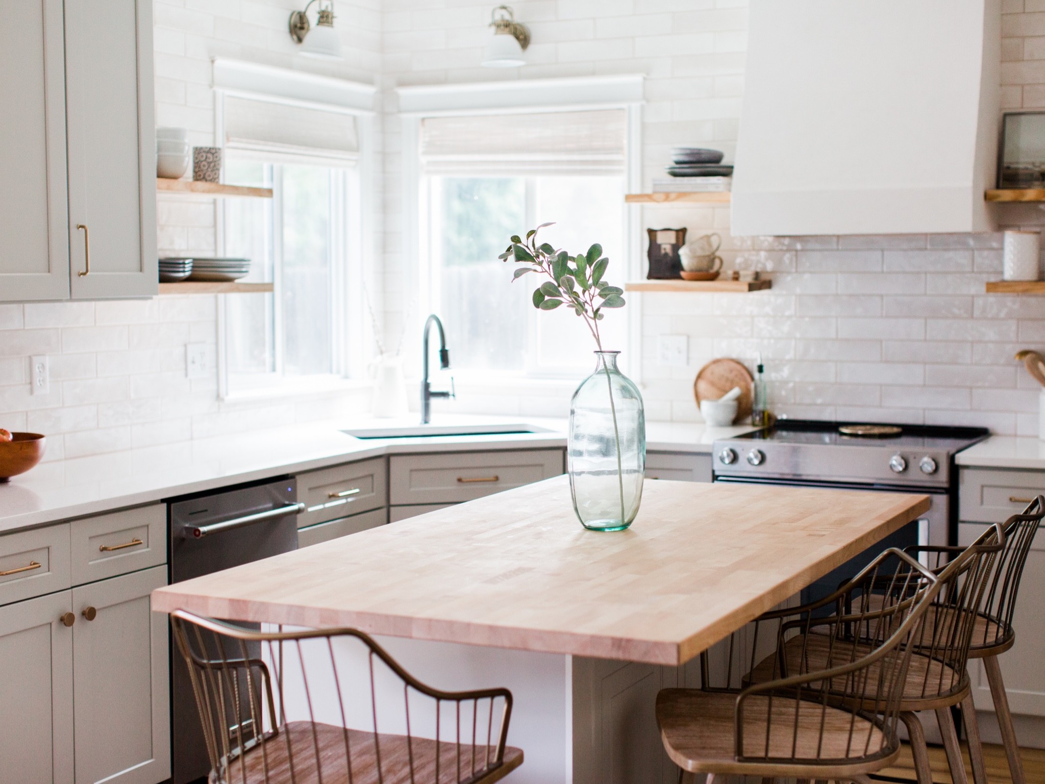 Transitional kitchen with brass hardware, wall sconces, bamboo shades

#LTKhome