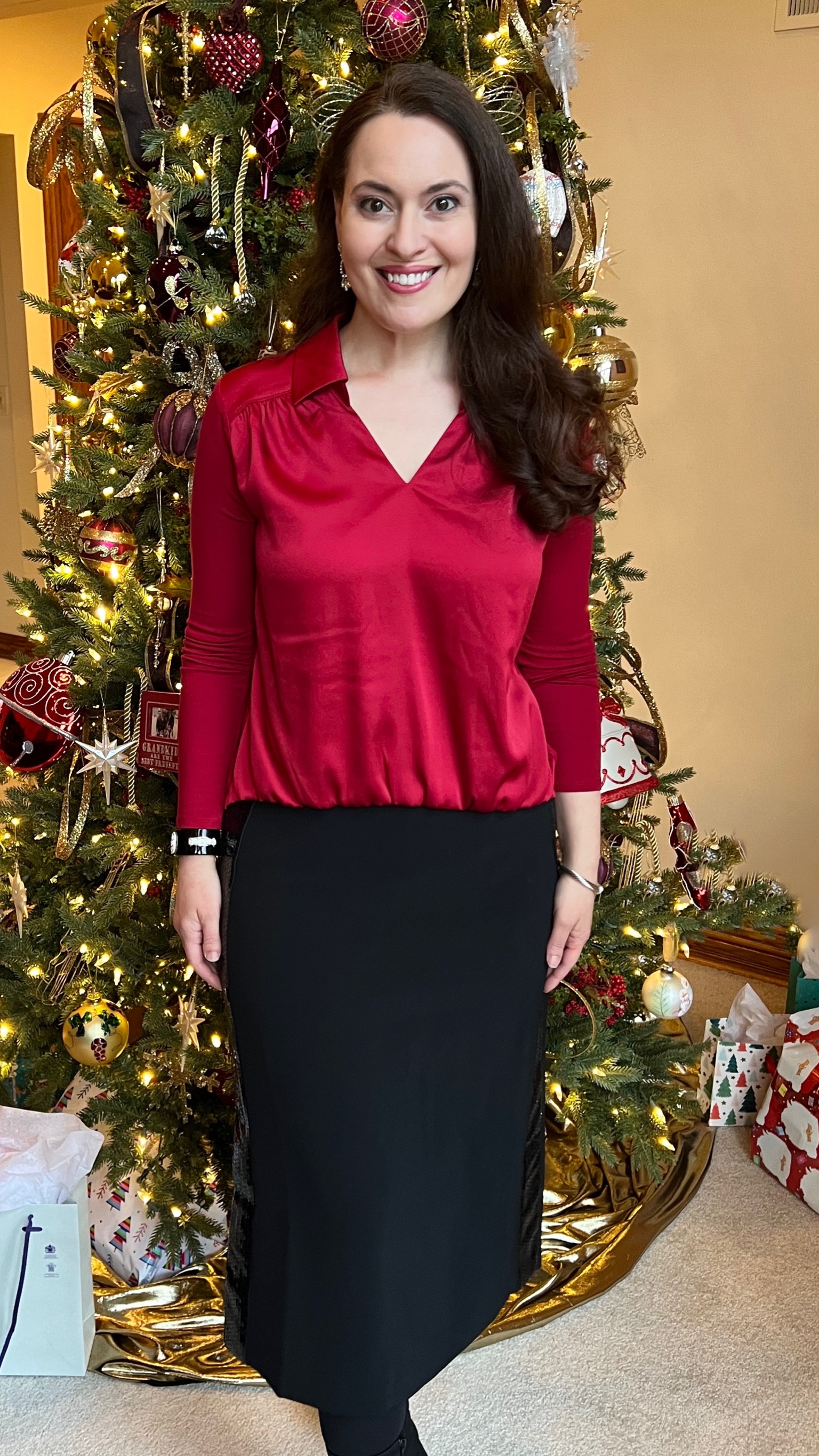 New Year’s Eve Holiday Outfit Inspo  - Wearing the small in the v-neck mixed media top. I love the beautiful shade of red of the top. It’s also available in magenta, white, and black. The top is shorter in the front so it pairs well with a high waisted skirt. The designer inspired black deco style cuff bracelet is on sale. 

#LTKHoliday #LTKSaleAlert #LTKStyleTip