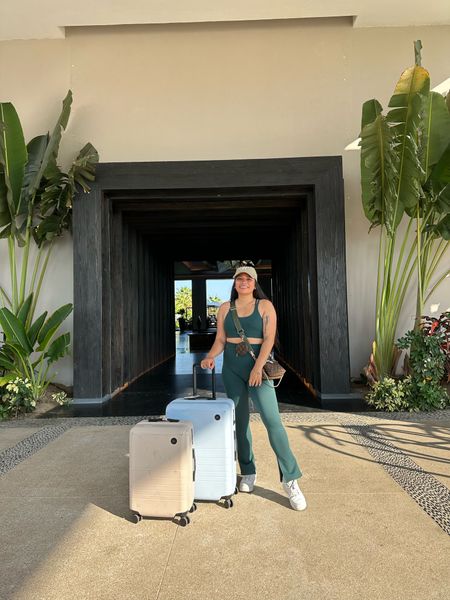 Checking out of my hotel at Punta Mita, Puerto Vallarta, Mexico! Wearing a @fabletics set to the airport, with a hat, sneakers, and crossbody bag. Also tagged my suitcases! 🧳 

#LTKfitness #LTKGiftGuide #LTKtravel
