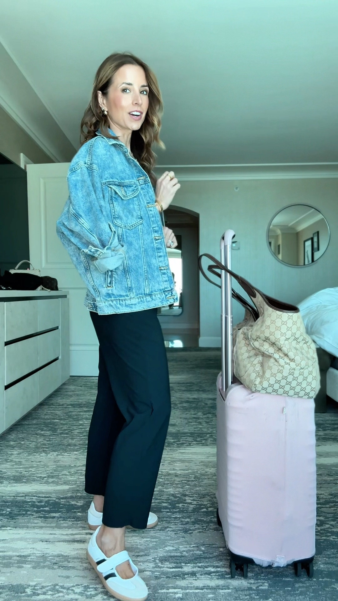 My travel outfit of the day. Amazon drapey ankle length pants for everyday + travel! These have a stretchy and elastic waistband. I am 5’3 and wearing XS. Airport outfit. Abercrombie bra-free scoopneck tank in XXS. Wrangler spicy denim jacket in XS. Adidas samba Mary Jane runs a smidge big but I didn’t size down because you can adjust the strap to tighten it. Beis luggage set. Gucci Mercato tote in size large.

#LTKootd #LTKTravel #LTKPetite