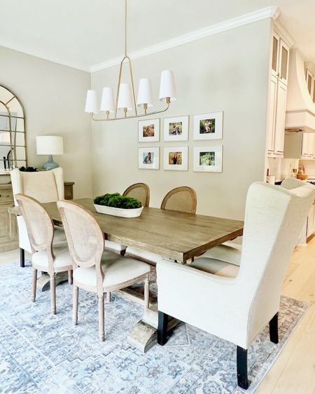 Want to add coziness to your #diningroom? Add family photos, upholstered chairs, an oversized rug, and dimmable lighting. You’ll never want mealtime to end. 👌🏻 
#WoodlandsStyleHouse 

#LTKHome #LTKStyleTip #LTKFamily