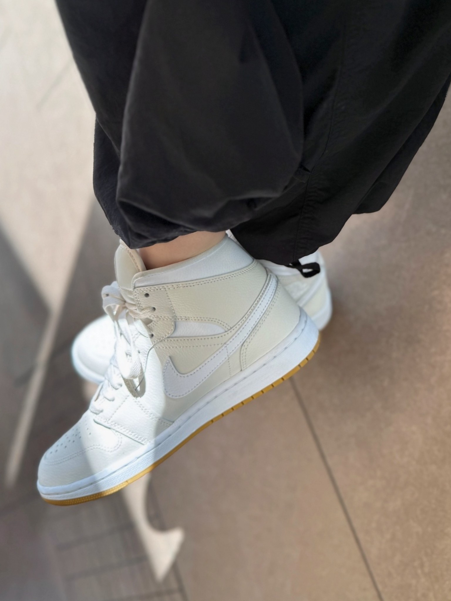 Air Jordan 1 Mid sneakers from @Nike US in a white on white pattern w a gum sole. I like these bc they’re neutral, not too white + monochromatic so it’s an easy match w lots of outfits. Wearing here w a casual black balloon pant.

#LTKActive #LTKSaleAlert #LTKootd