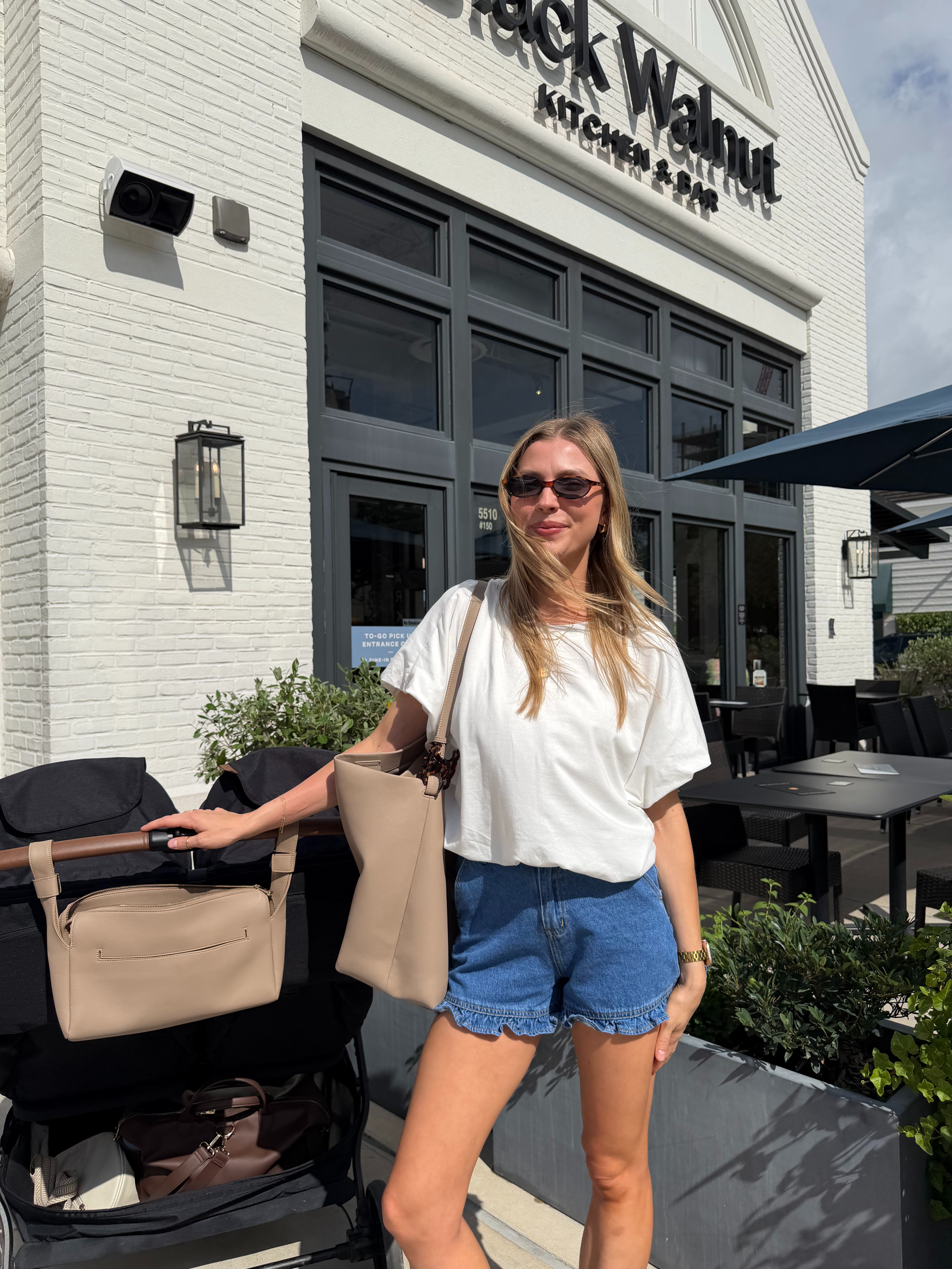 Nursing friendly summer mom outfit | 2 in ruffle denim shorts + M in white bubble tee 
 

 #LTKootd #LTKmomlife