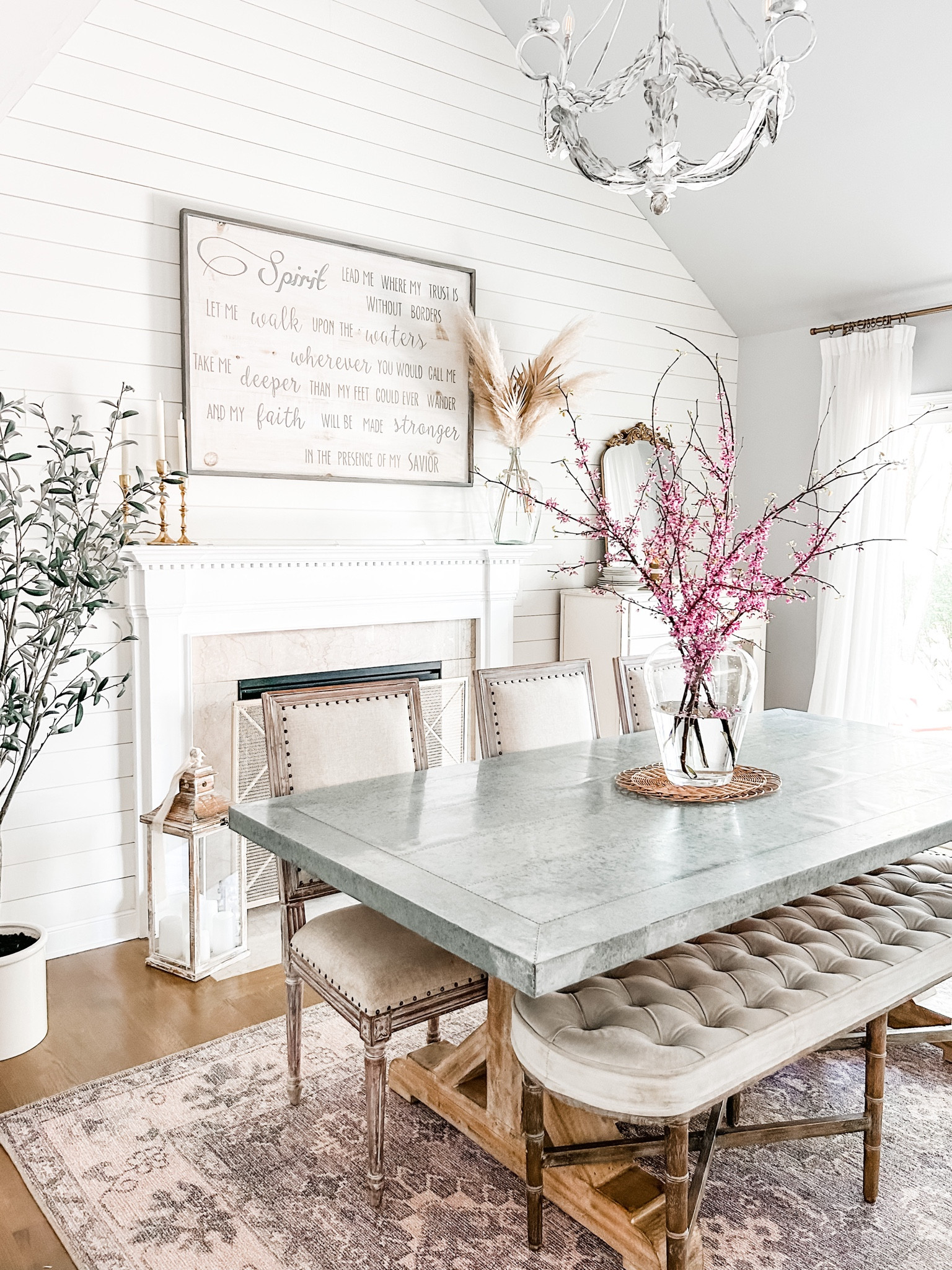 Dining room home decor. 

Dining room decor, upholstered bench, dining table bench, zinc top table, Farmhouse table, blush area rug, artificial tree, artificial olive tree, faux olive tree, fireplace screen, fire screen, gold taper candle holders, flameless candles, pampas grass stems, pinch pleat curtains, off white faux linen curtains, Amazon curtains, Amazon drapes, curtain clip rings, farmhouse decor, farmhouse chandelier, dining room chandelier. Dining chairs, upholstered dining chair with nail head trim. Dining room rug, gold wall mirror, arched wall mirror. 

#LTKstyletip #LTKFind #LTKhome