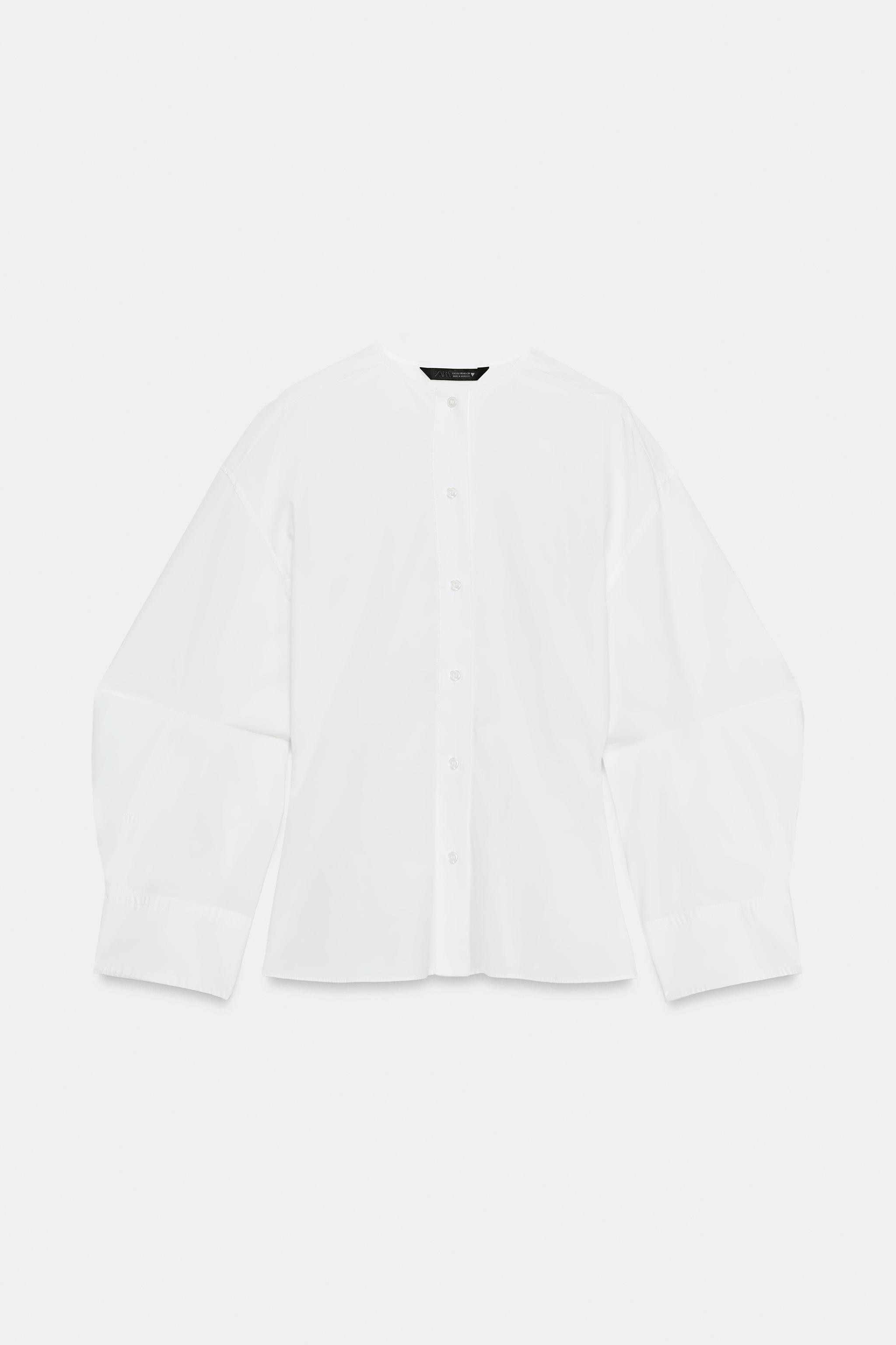 Fitted shirt featuring a round neck and long, voluminous sleeves with a slit. Button-up front. | Zara UK