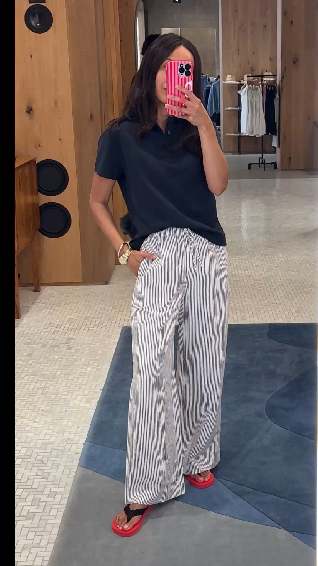 Summer pants outfit. 
Polo shirt is a nice all cotton top. Double knit fabric is very soft and has structure to it. True to size. Navy color is chic. 
Striped wide leg linen blend pants look so cute!  True to size. Nice material with good drape. Flattering fit and stylish cut. 
Red flip flops.

#LTKOver40 #LTKootd